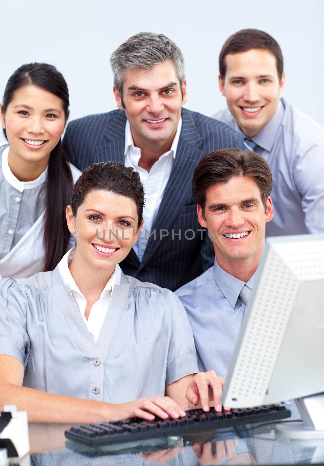 Successful business people working at a computer by Wavebreakmedia