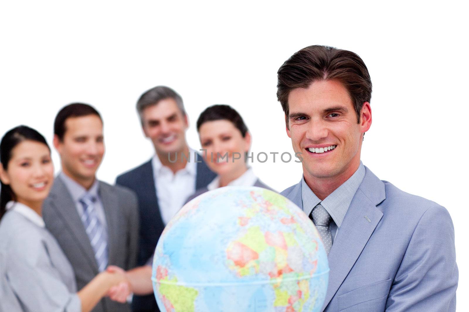 Successful manager and his team holding a terrestrial globe against a white background