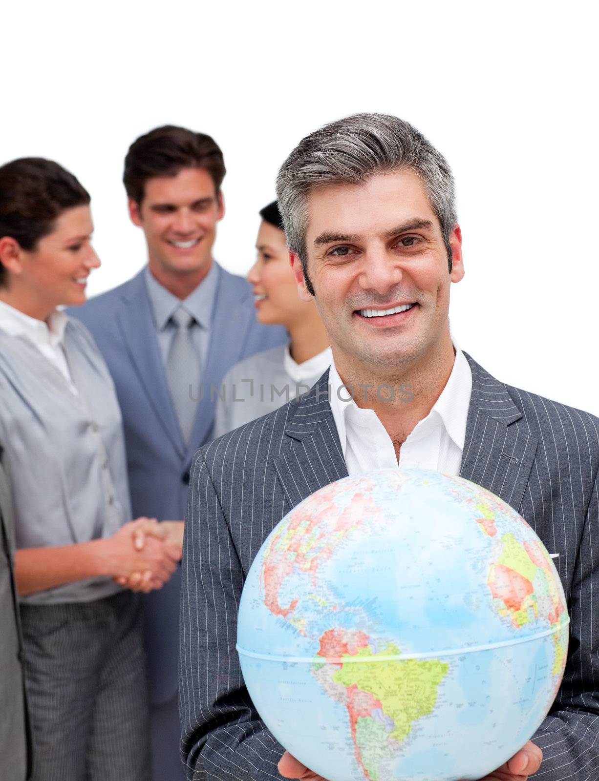 Ambitious manager and his team holding a terrestrial globe against a white background