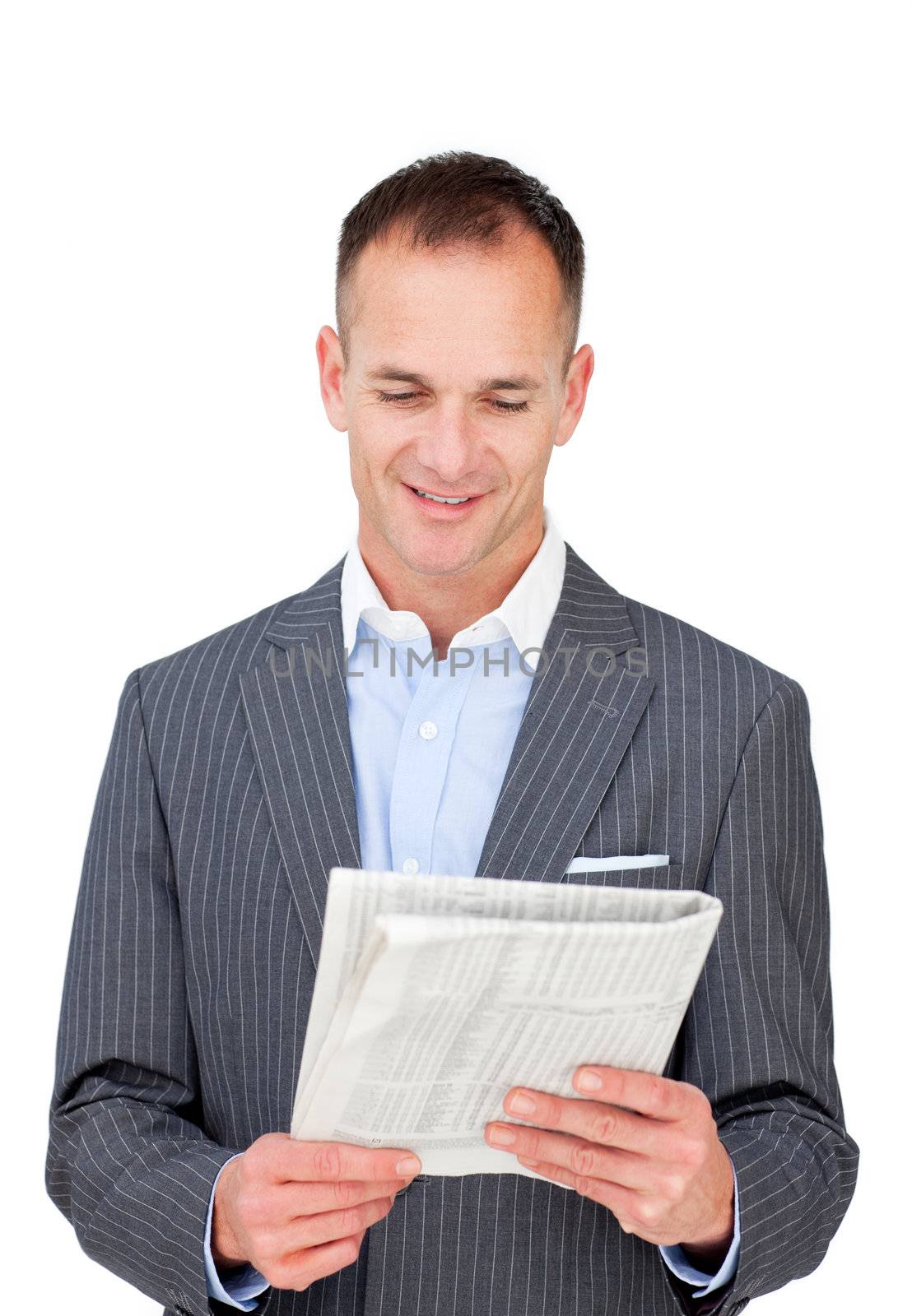 Positive businessman reading a newspaper  by Wavebreakmedia