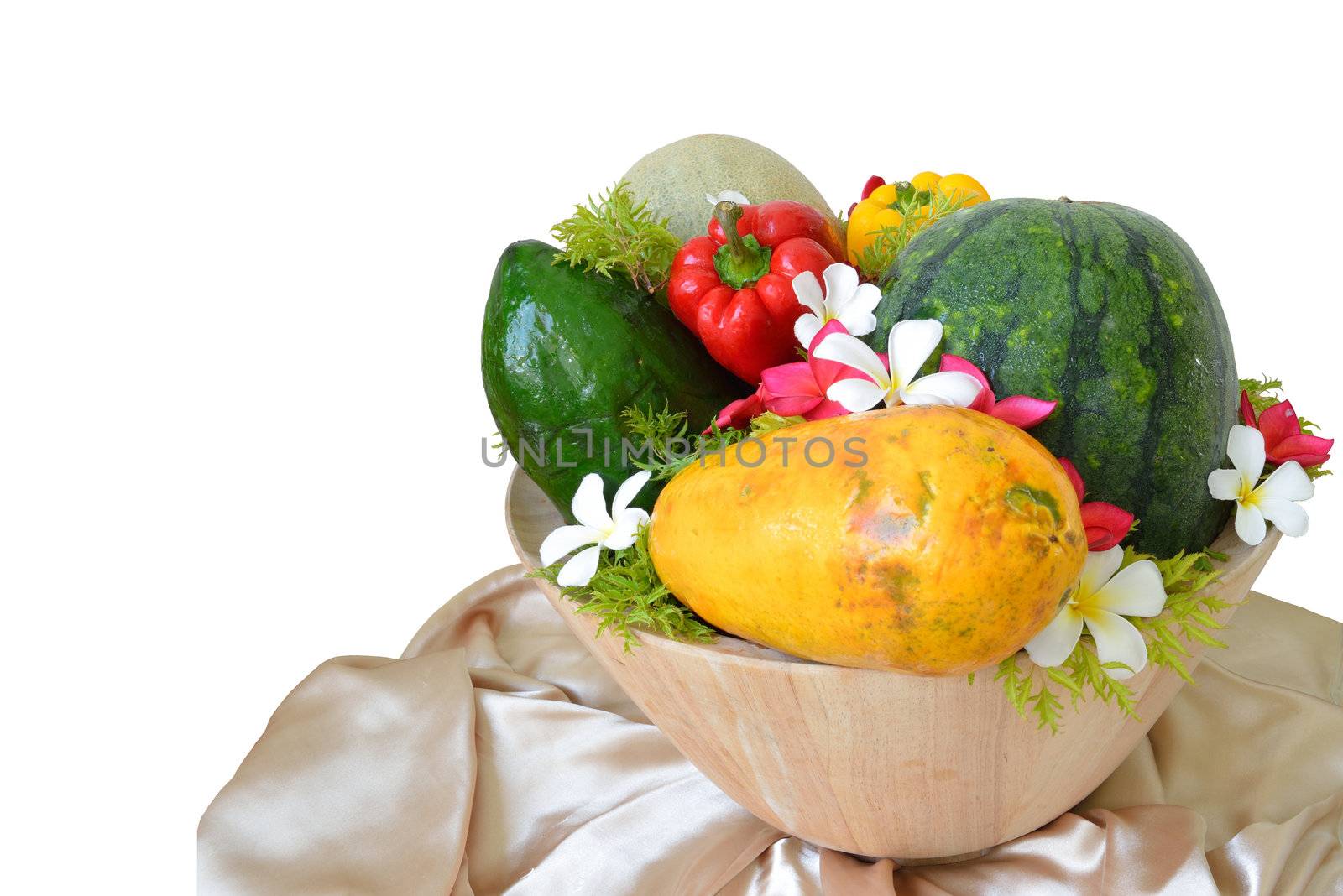 Decoration fruit with flower and vegetable in the wooden bowl and isolated on white background.