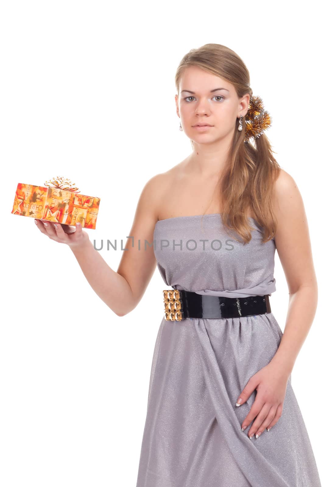 girl celebrates Christmas with a gift in the hands of studio photography