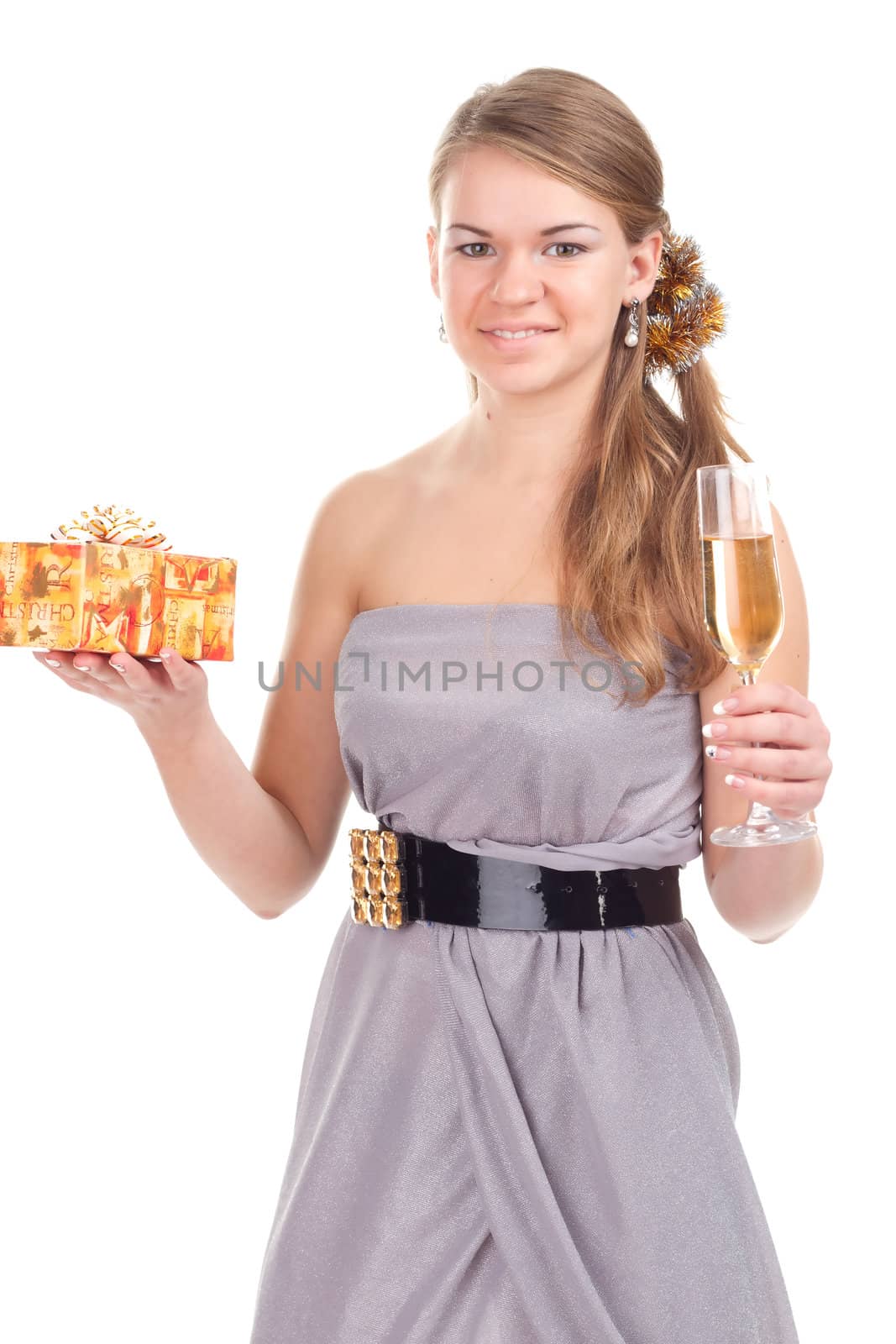 girl celebrates Christmas with a gift in the hands of studio photography