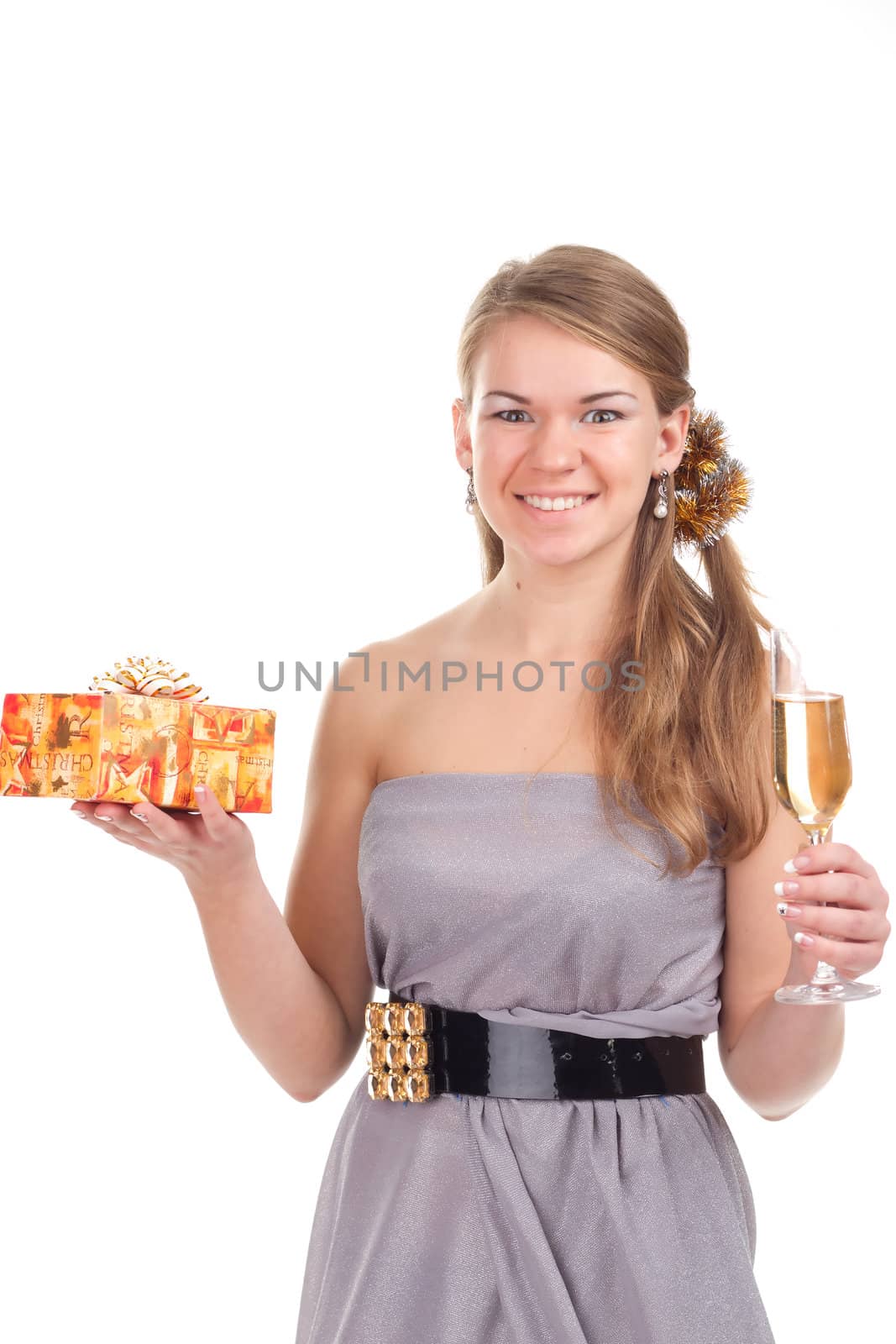 girl celebrates Christmas with a gift in the hands of studio photography