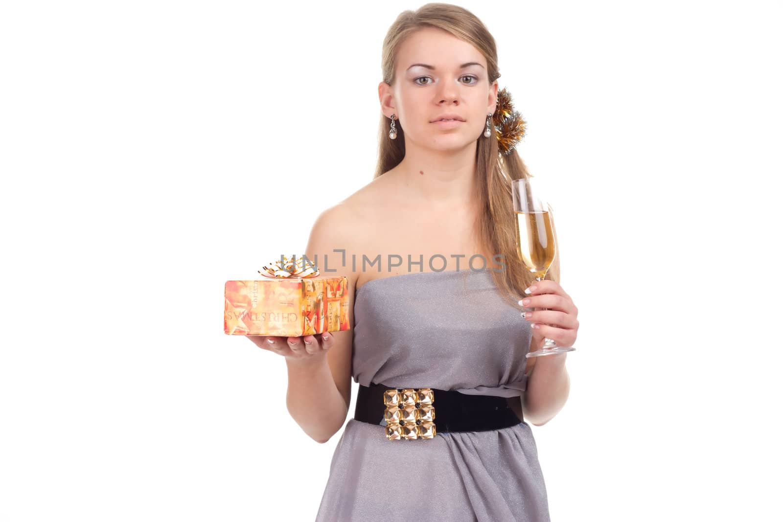 girl celebrates Christmas with a gift in the hands of studio photography
