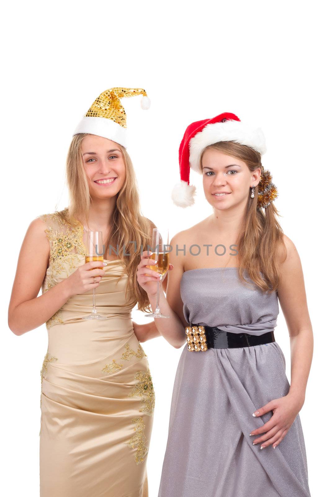 Two girls celebrate Christmas with gifts and glasses in their hands studio shooting