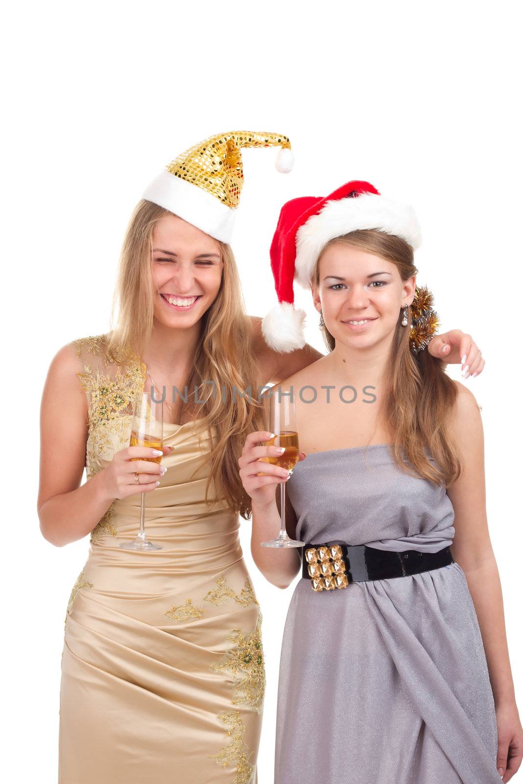 Two girls celebrate Christmas with gifts and glasses in their hands studio shooting