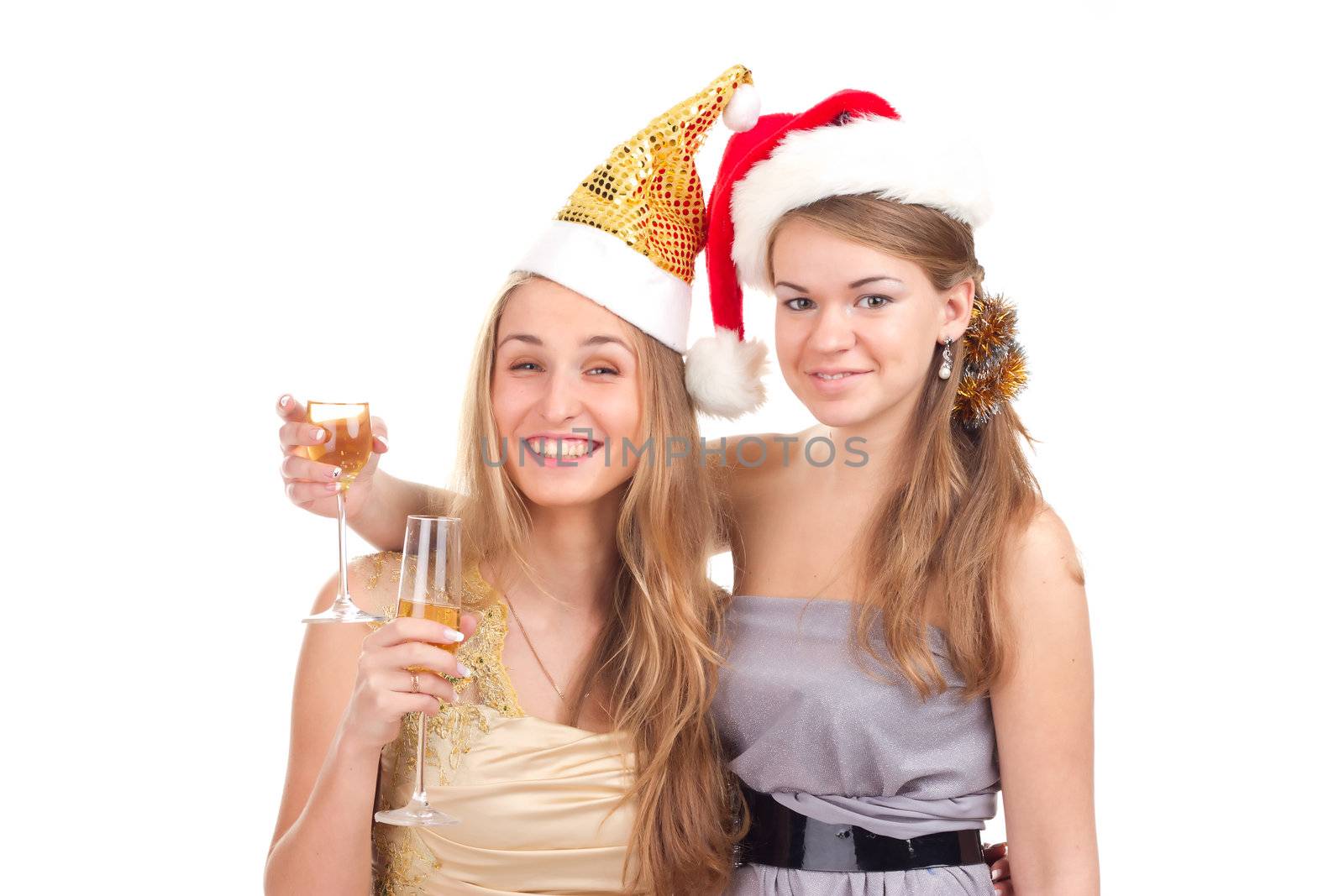 Two girls celebrate Christmas with gifts and glasses in their hands studio shooting