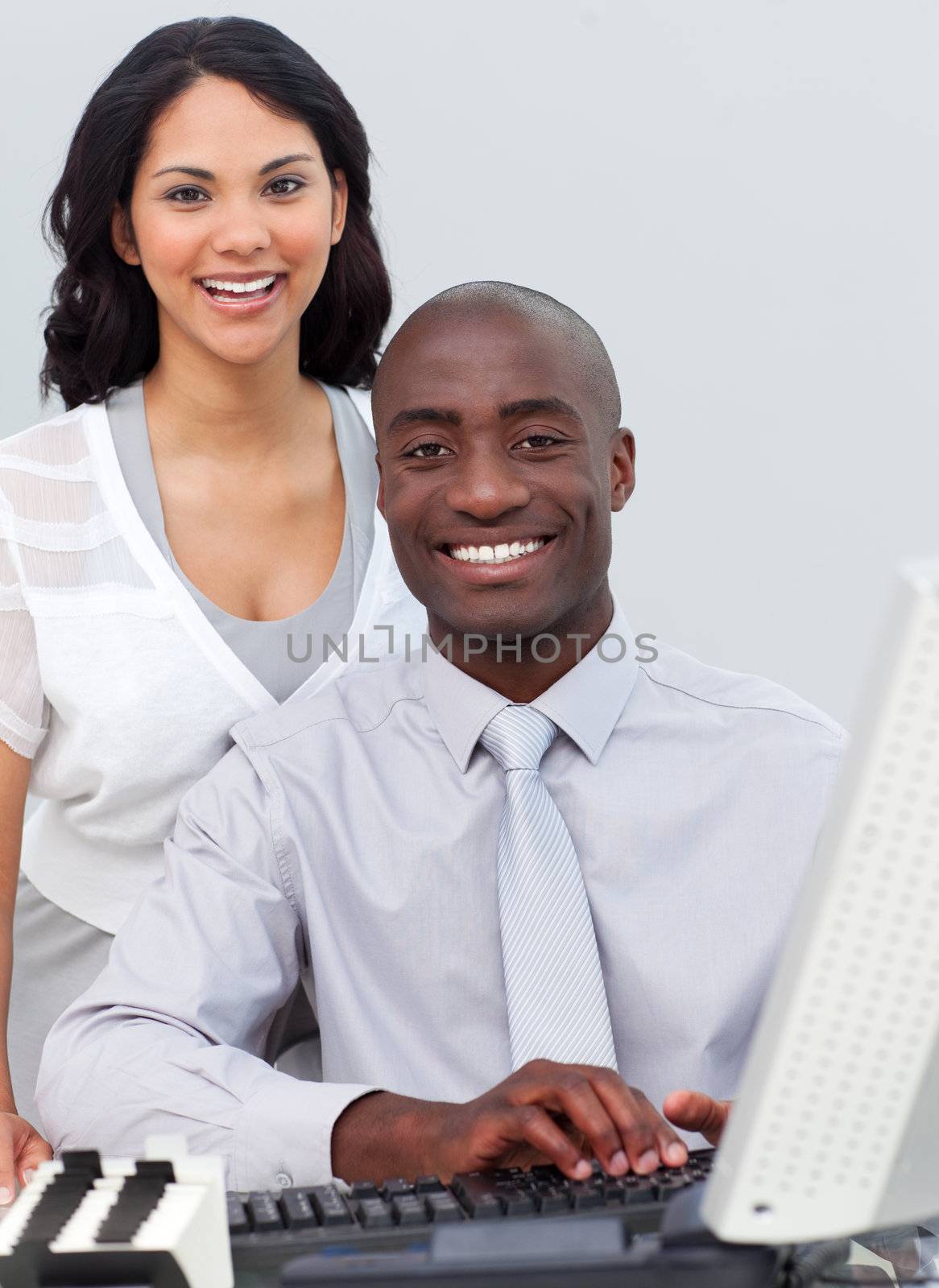 Multi-ethnic business team working at a computer in the office
