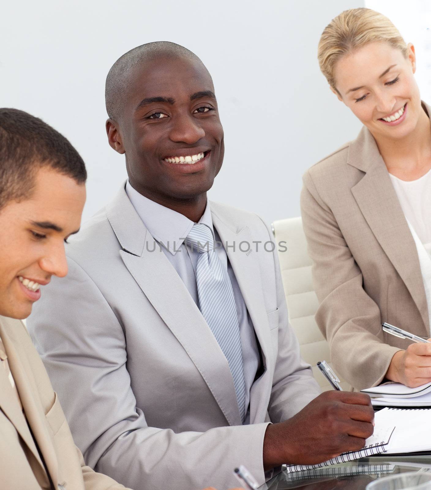 Business People Smiling in a meeting  by Wavebreakmedia