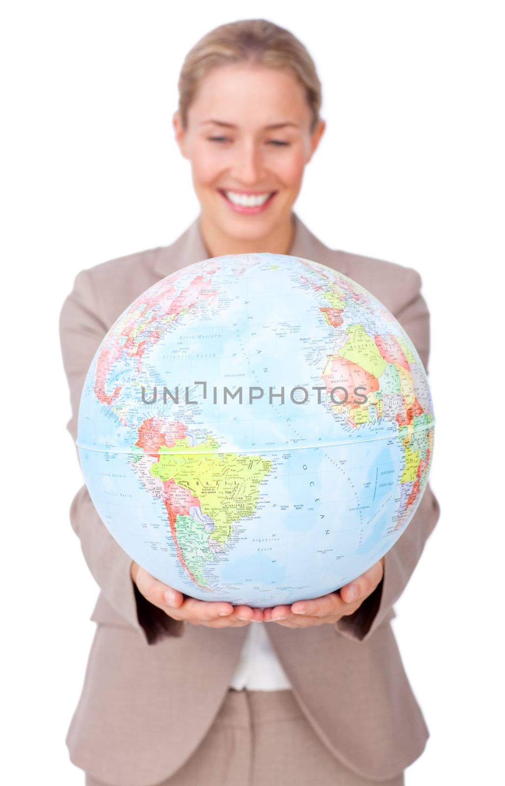 Charismatic businesswoman smiling at global business expansion against a white background