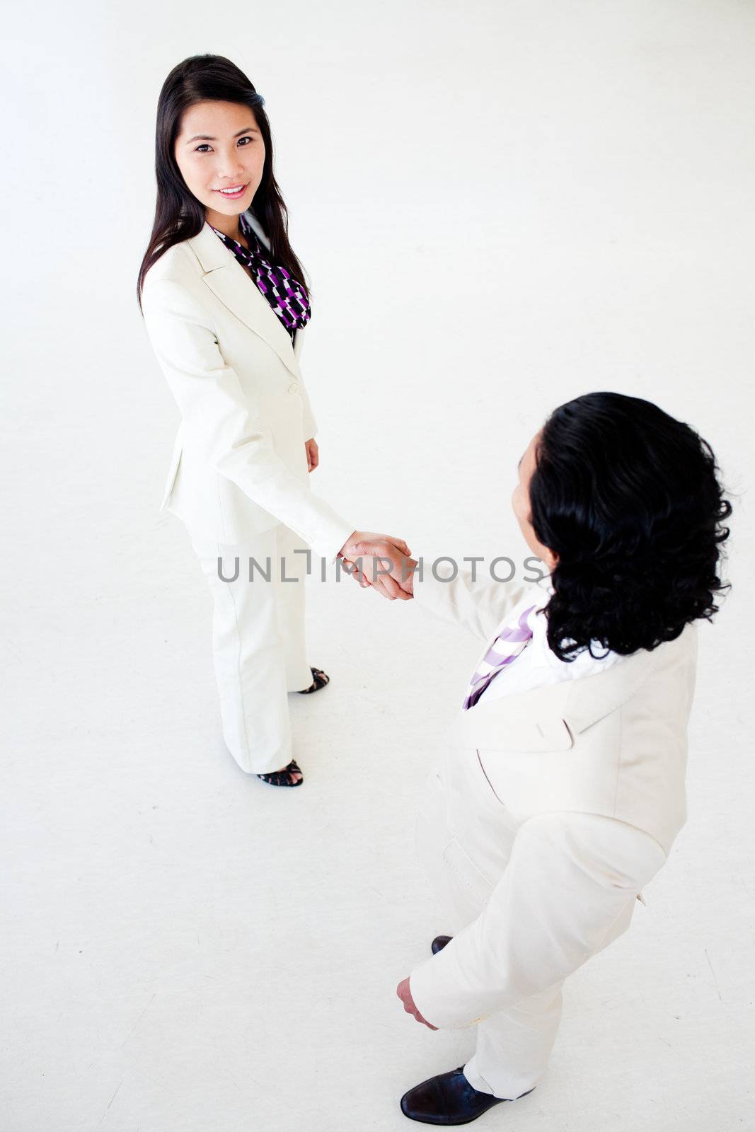 A diverse business people greeting each other in a business building