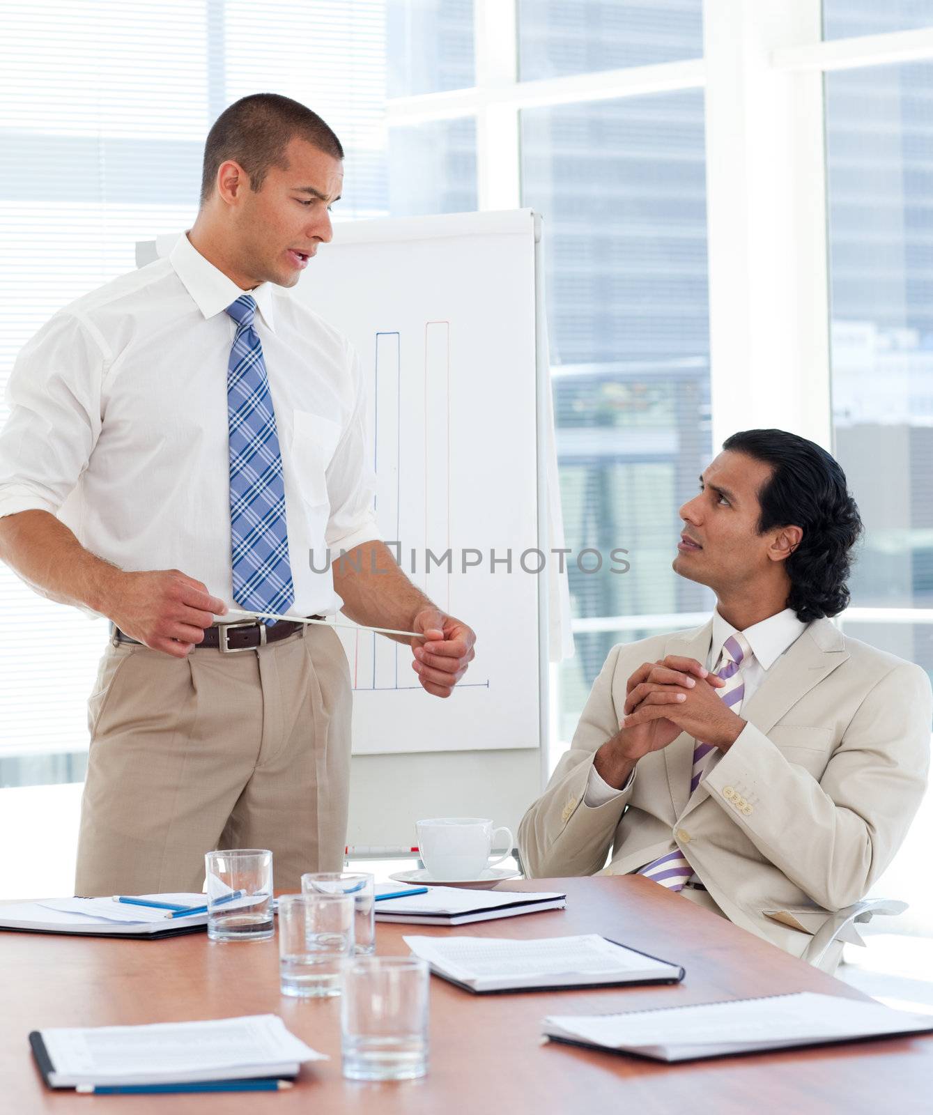 Serious businessman giving a presentation in a company