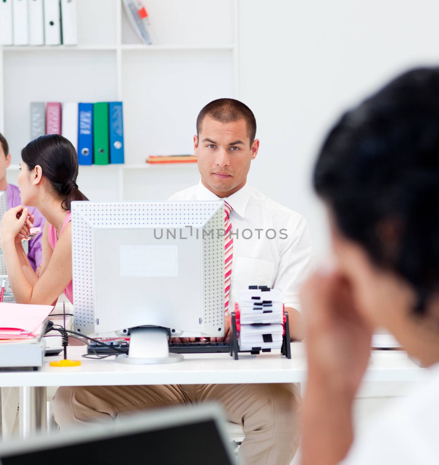 Serious businessman working at a computer in the office