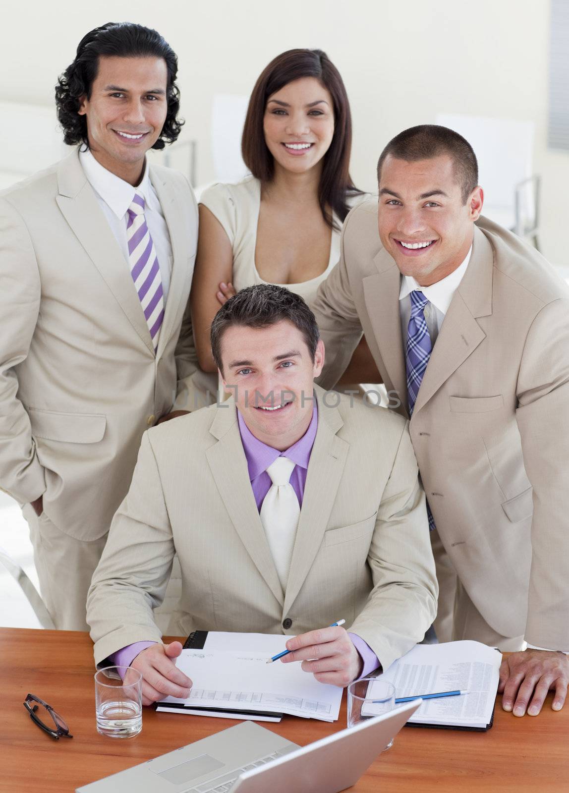Assertive business people studying a document in a meeting