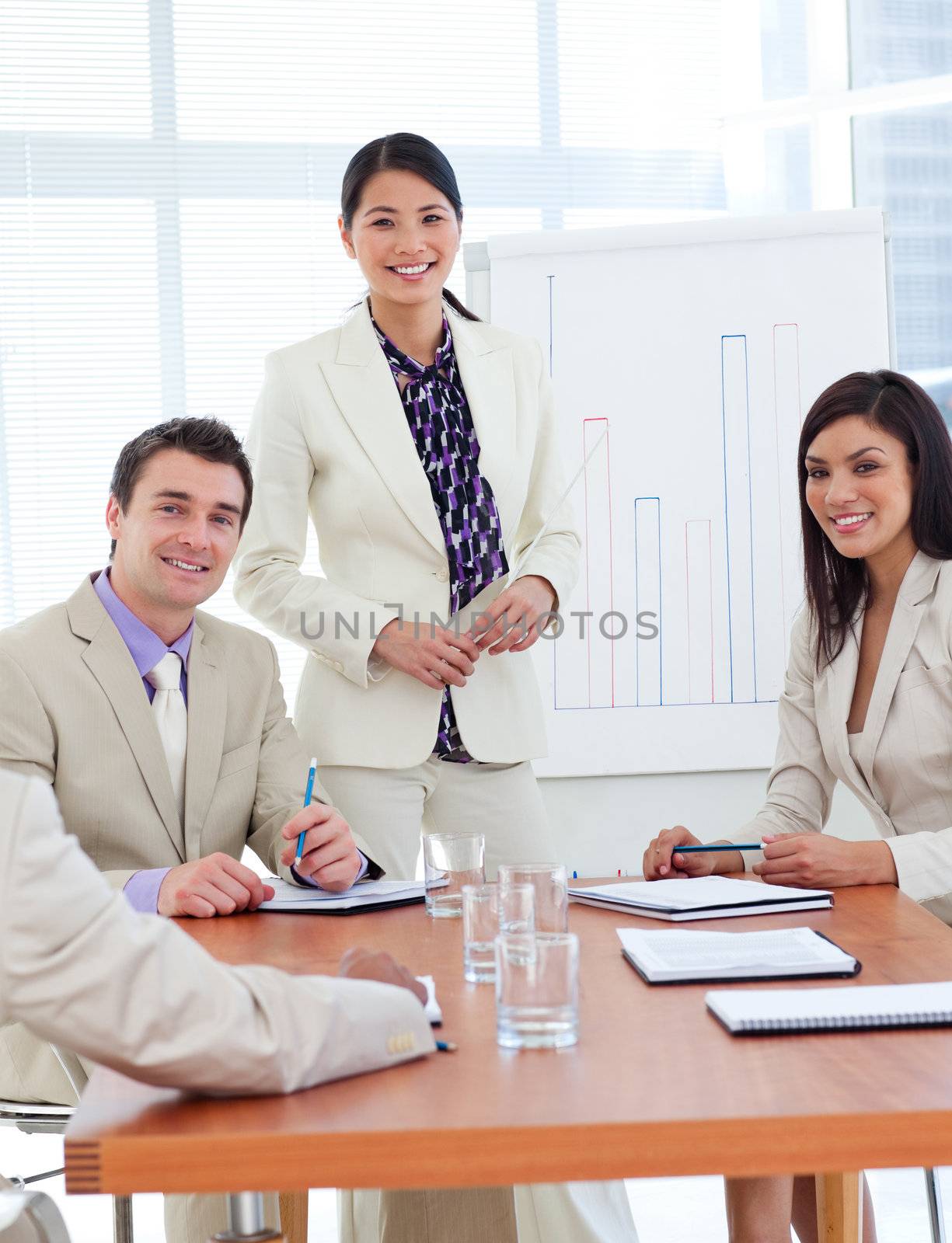 Positive businesswoman doing a presentation to her team