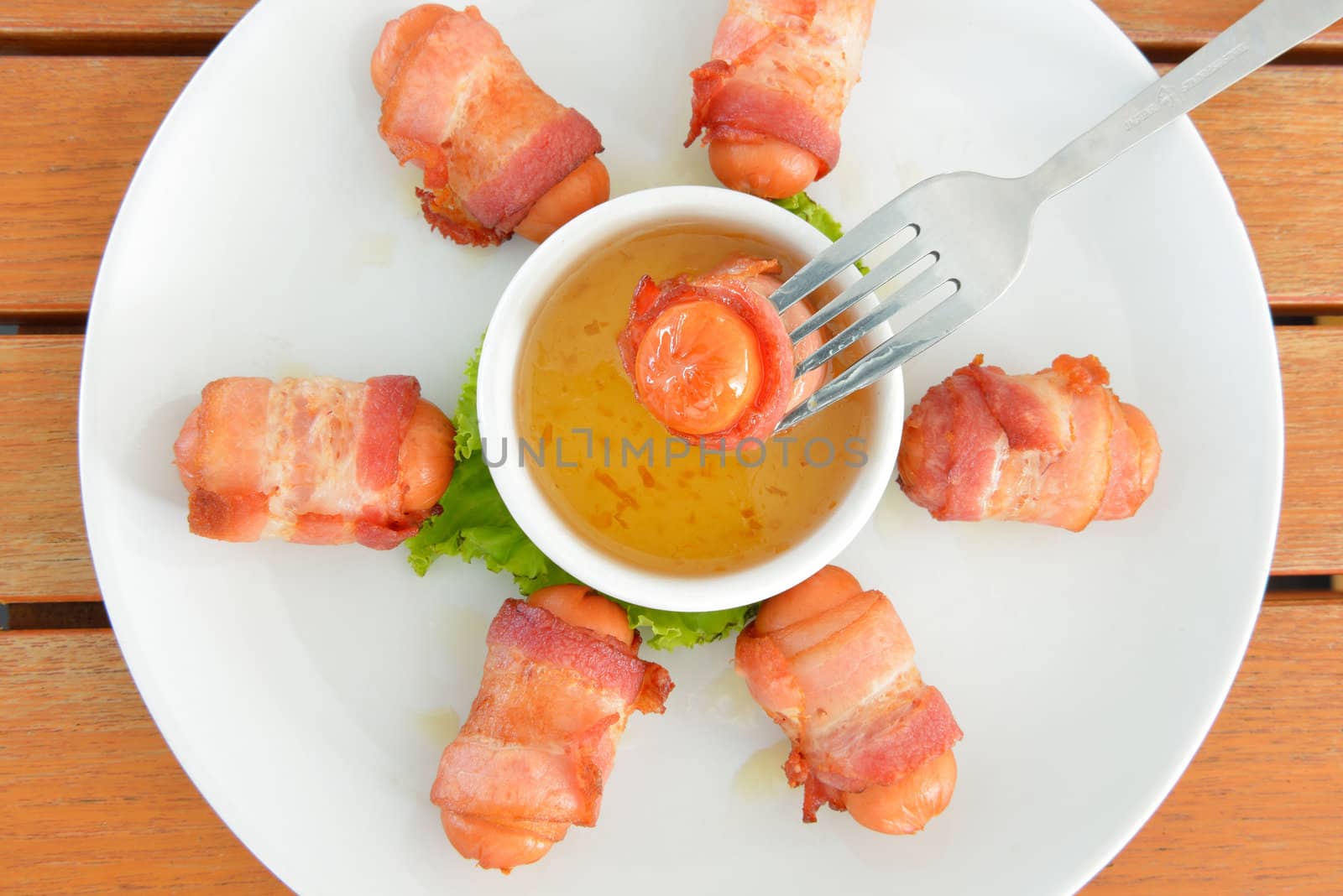 Top view of food call "Deep fired sausage wrapped with bacon"