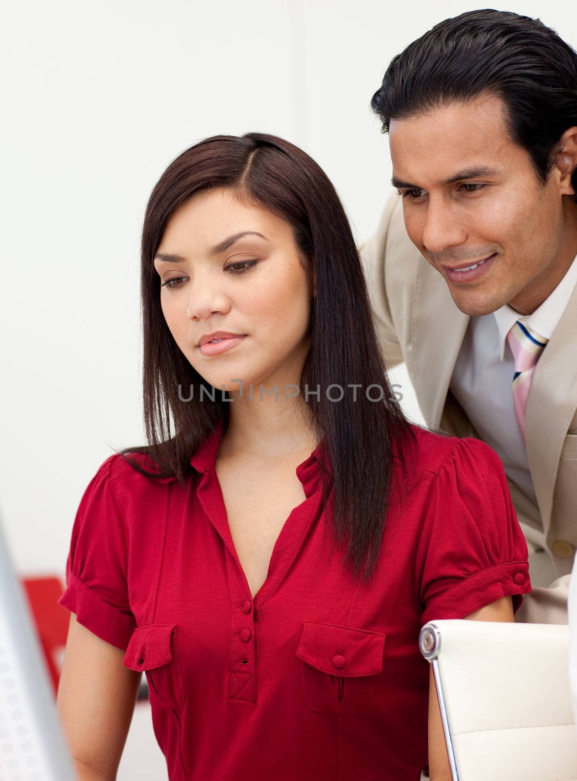 Concentrated multi-ethnic business people working together by Wavebreakmedia