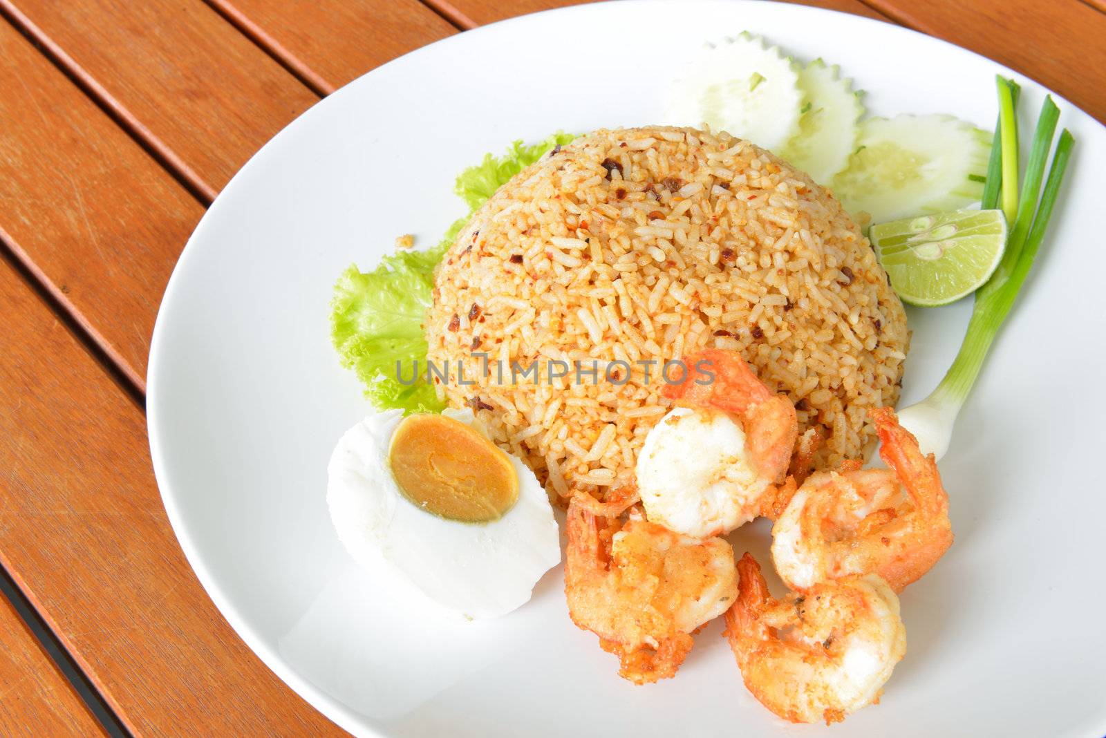Thai food style call "Fried rice with chili paste" served with fried shrimp and salted egg.
