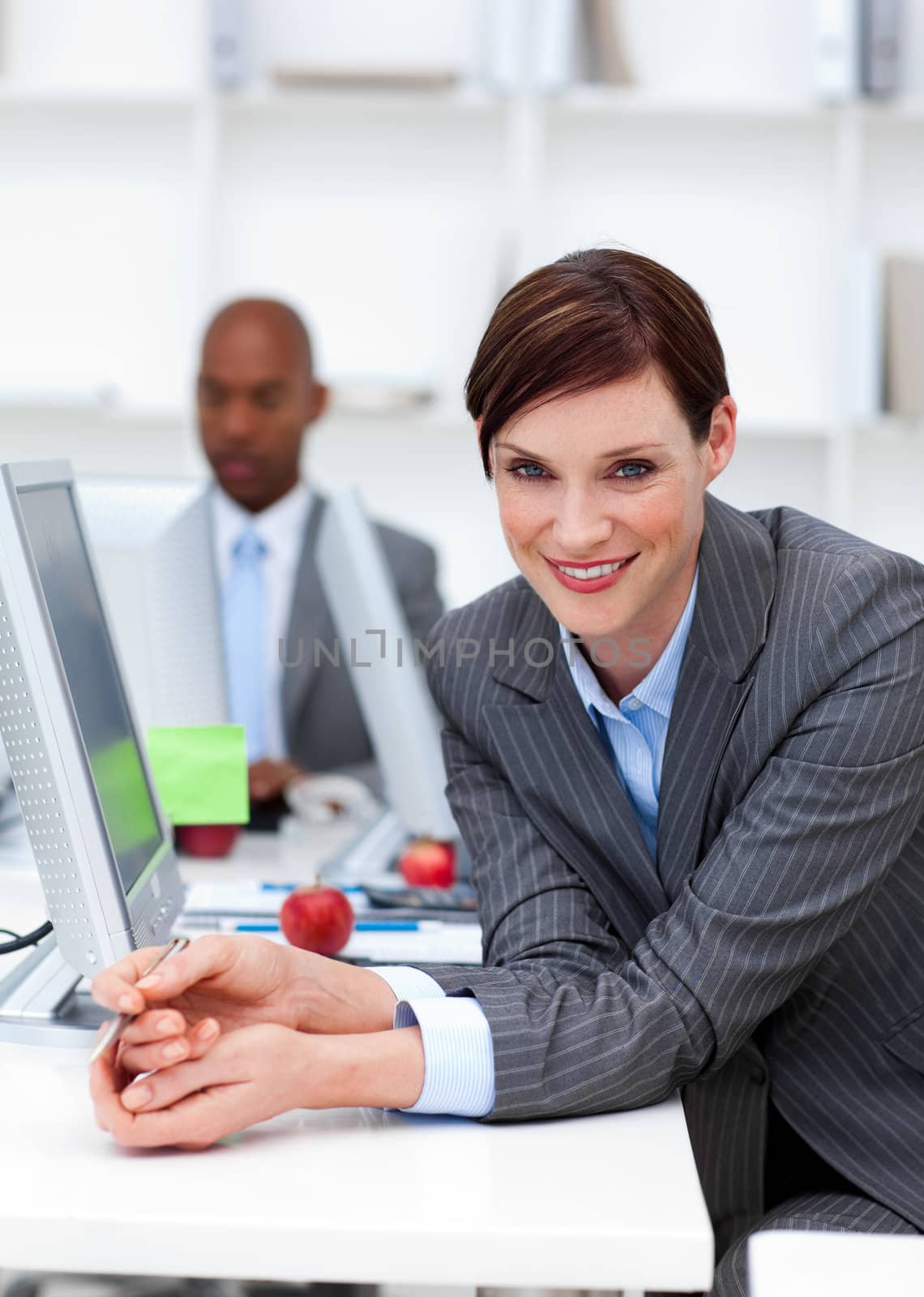 Smiling businesswoman at work with her colleague in the backgrou by Wavebreakmedia