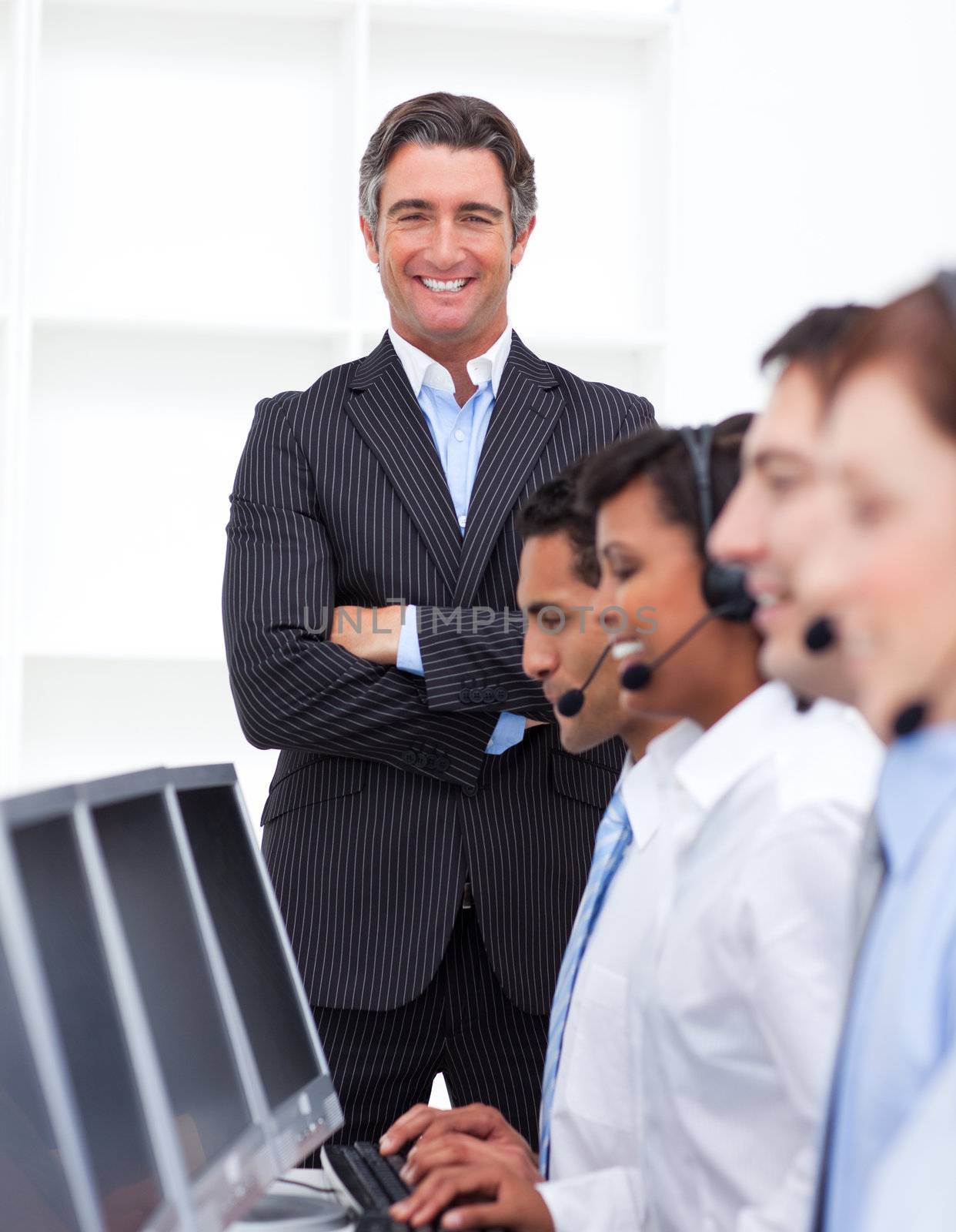 Self-assured businessman presenting a call center in a company