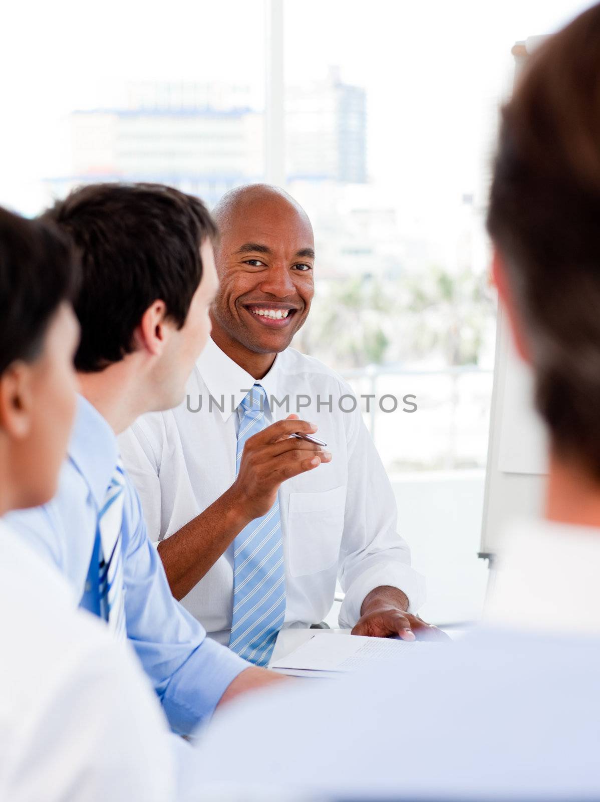 Portrait of smiling business team during a meeting in the office