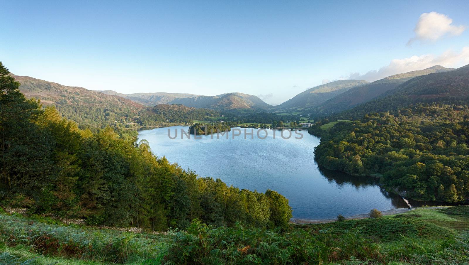 Overlook of Grasmere in Lake District as sunrise as sun light mountains