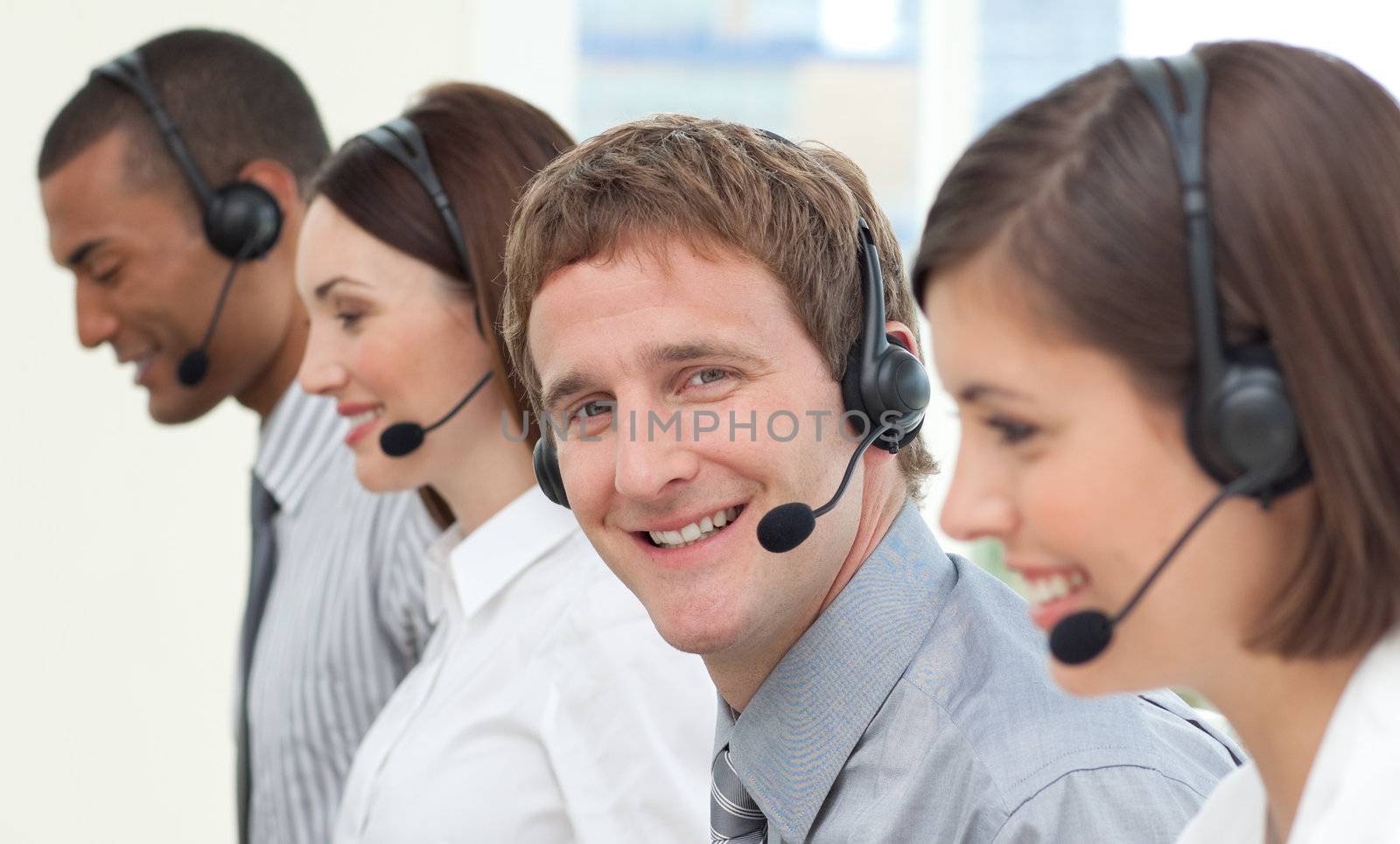 Business people with headset on in a call center