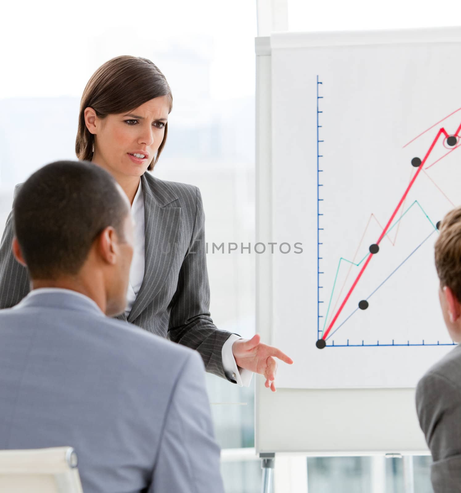 Young female executive presenting statistics in a company