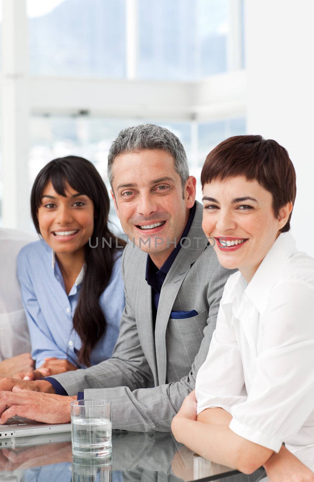 A diverse business team sitting in a row  by Wavebreakmedia