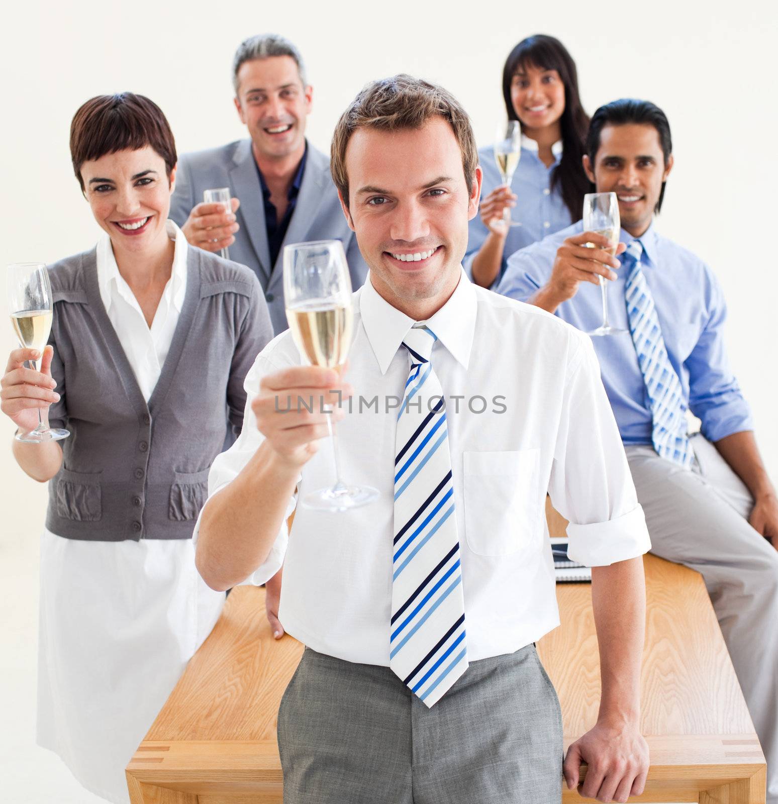 International business people toasting with Champagne in the office