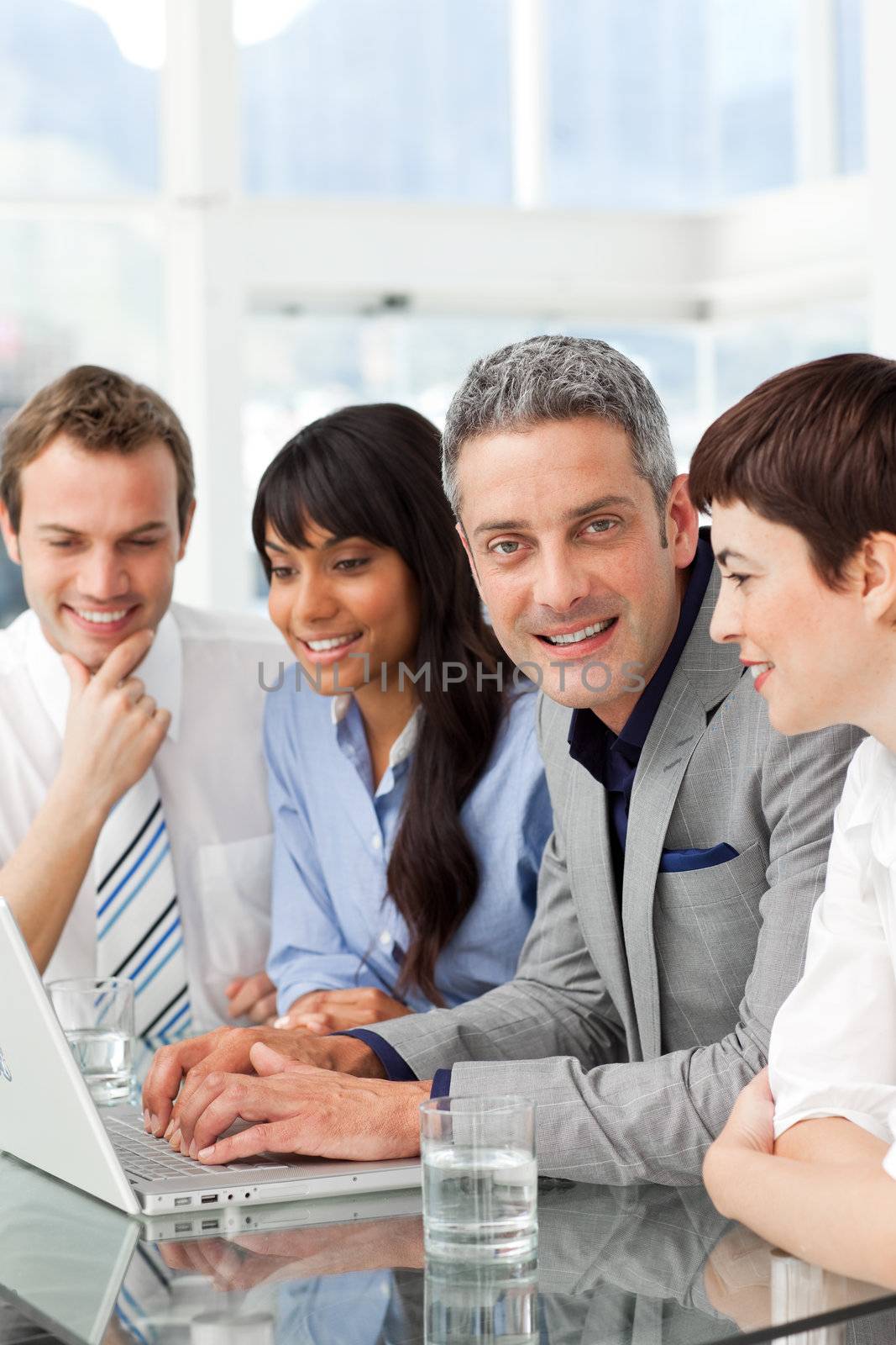 Multi-ethnic business partners sitting together in the office