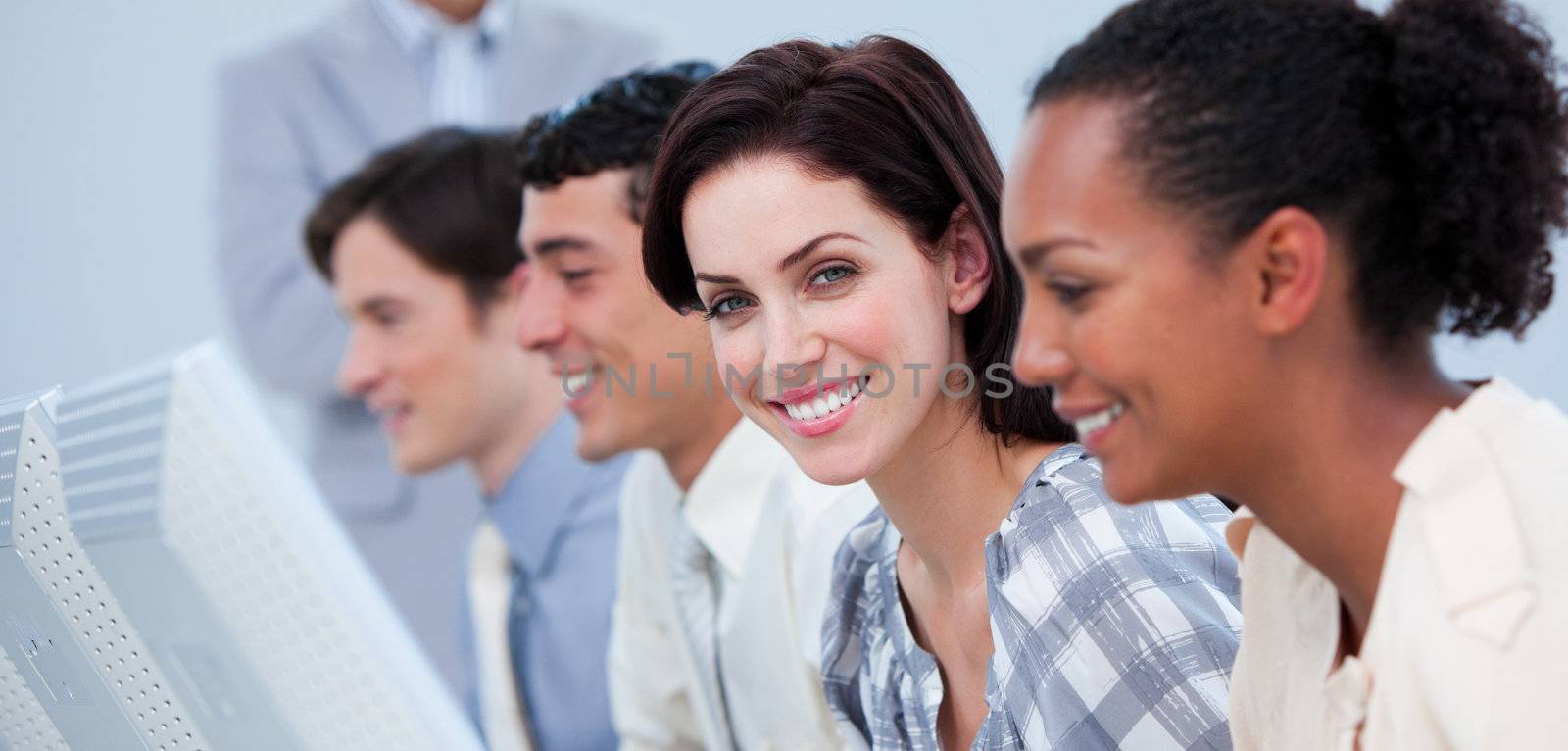 Smiling business people showing ethnic diversity  by Wavebreakmedia