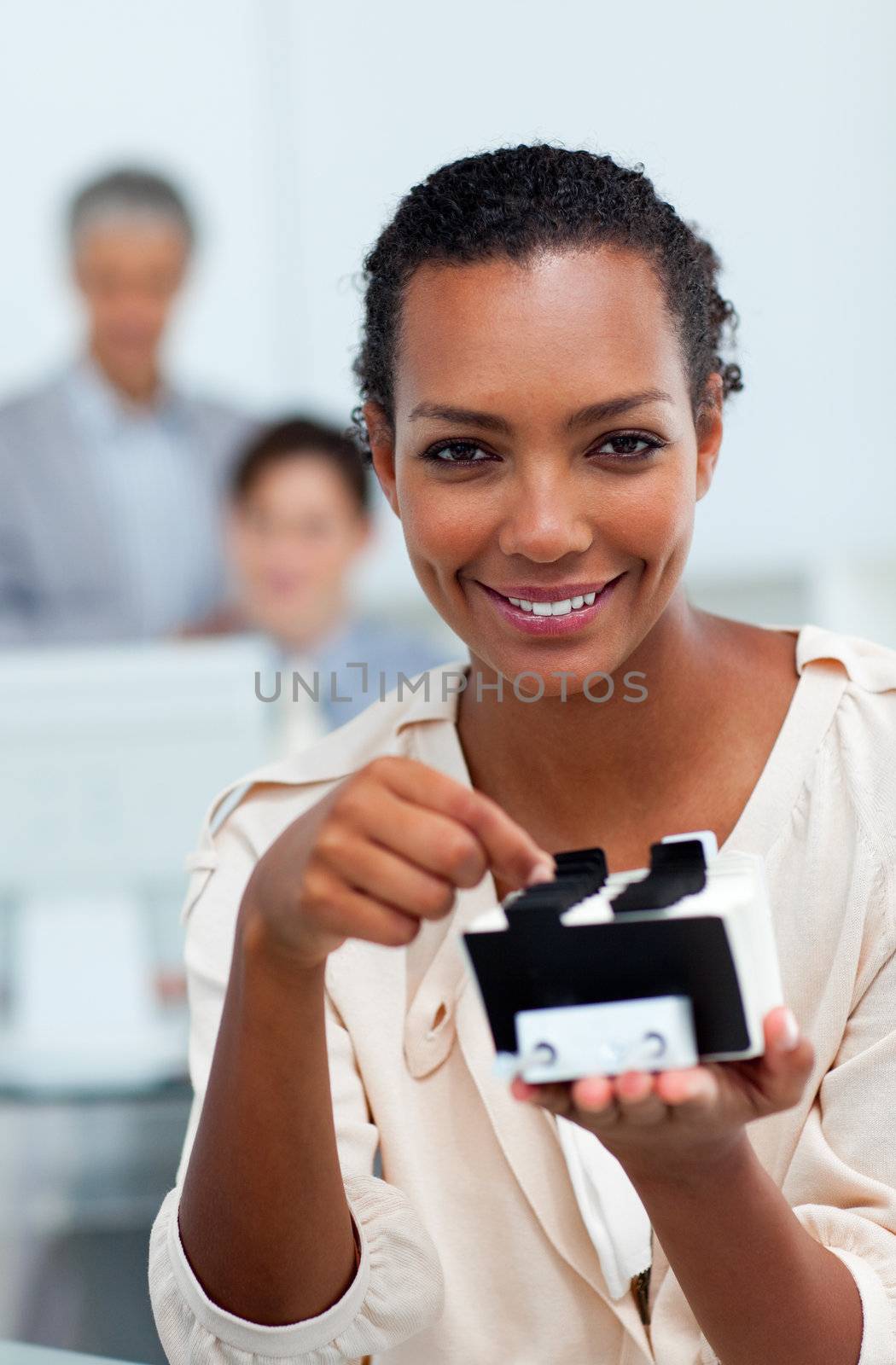 Cheerful busineswoman searching for the index in the office