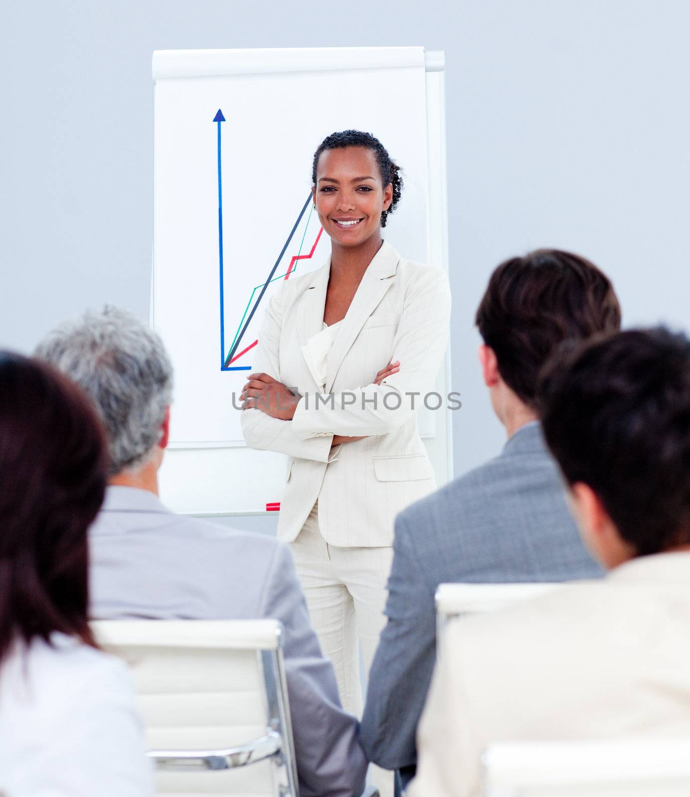 Attractive businesswoman doing a presentation to her colleagues