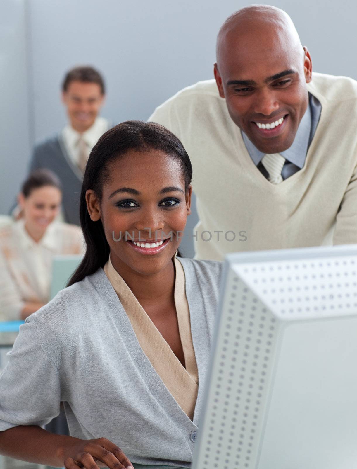 Assertive business partners working at a computer in the office