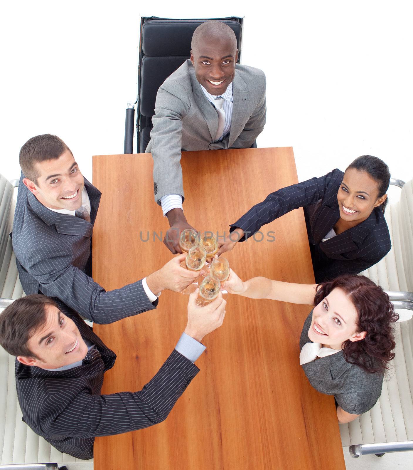 Business people celebrating a success with champagne in a meeting