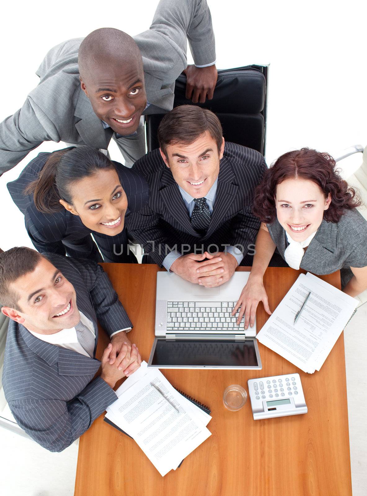 HIgh angle of business people working together with a laptop