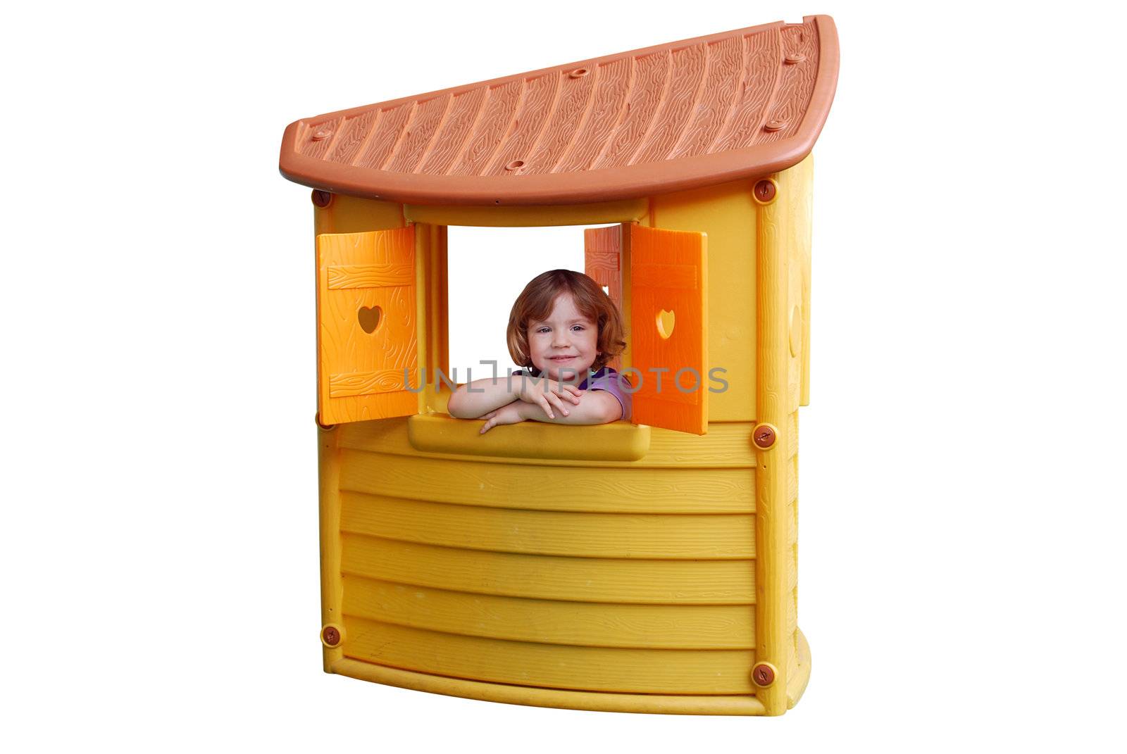 Little girl in playhouse toy isolated