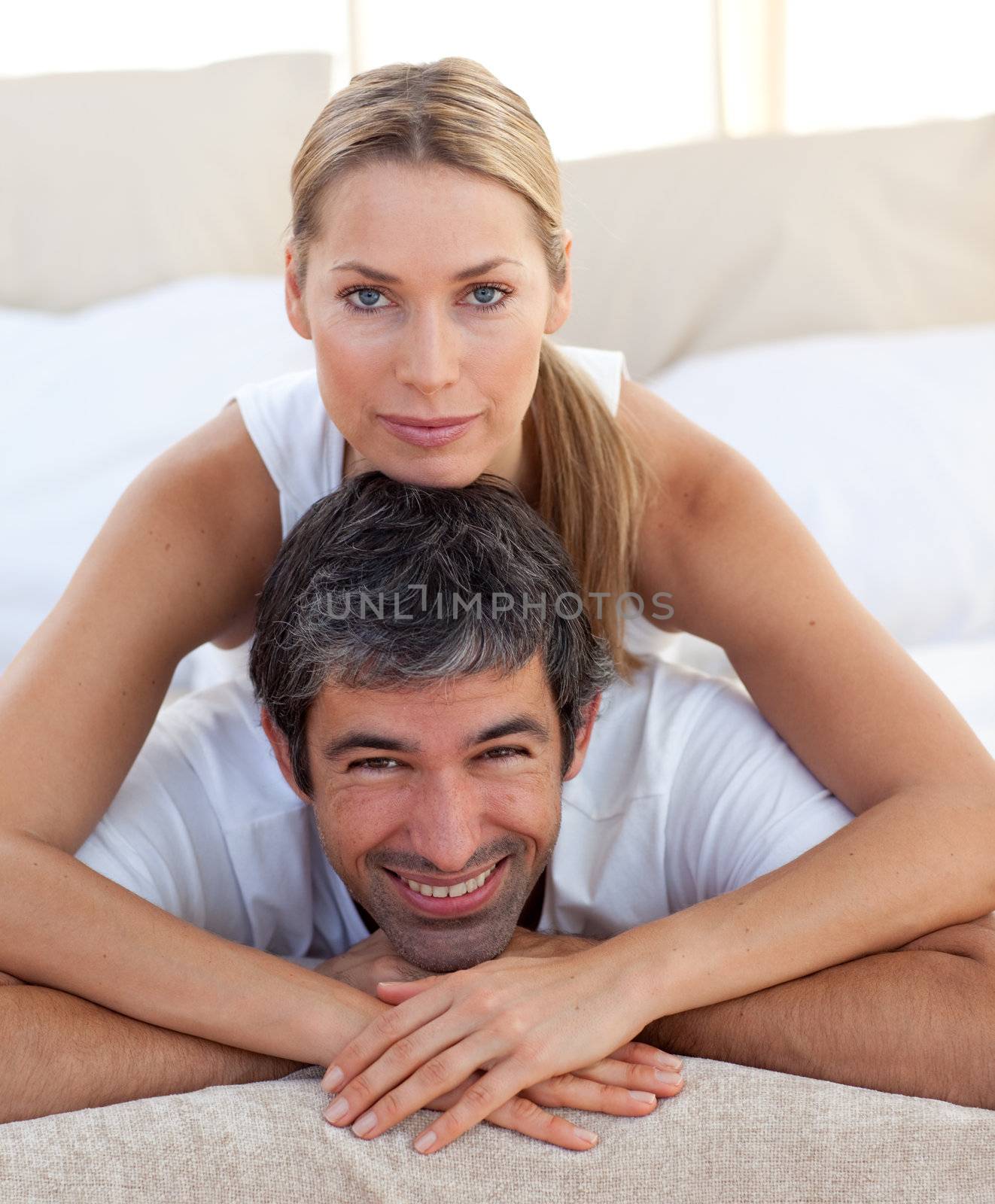 Close-up of a romantic couple lying on the bed
