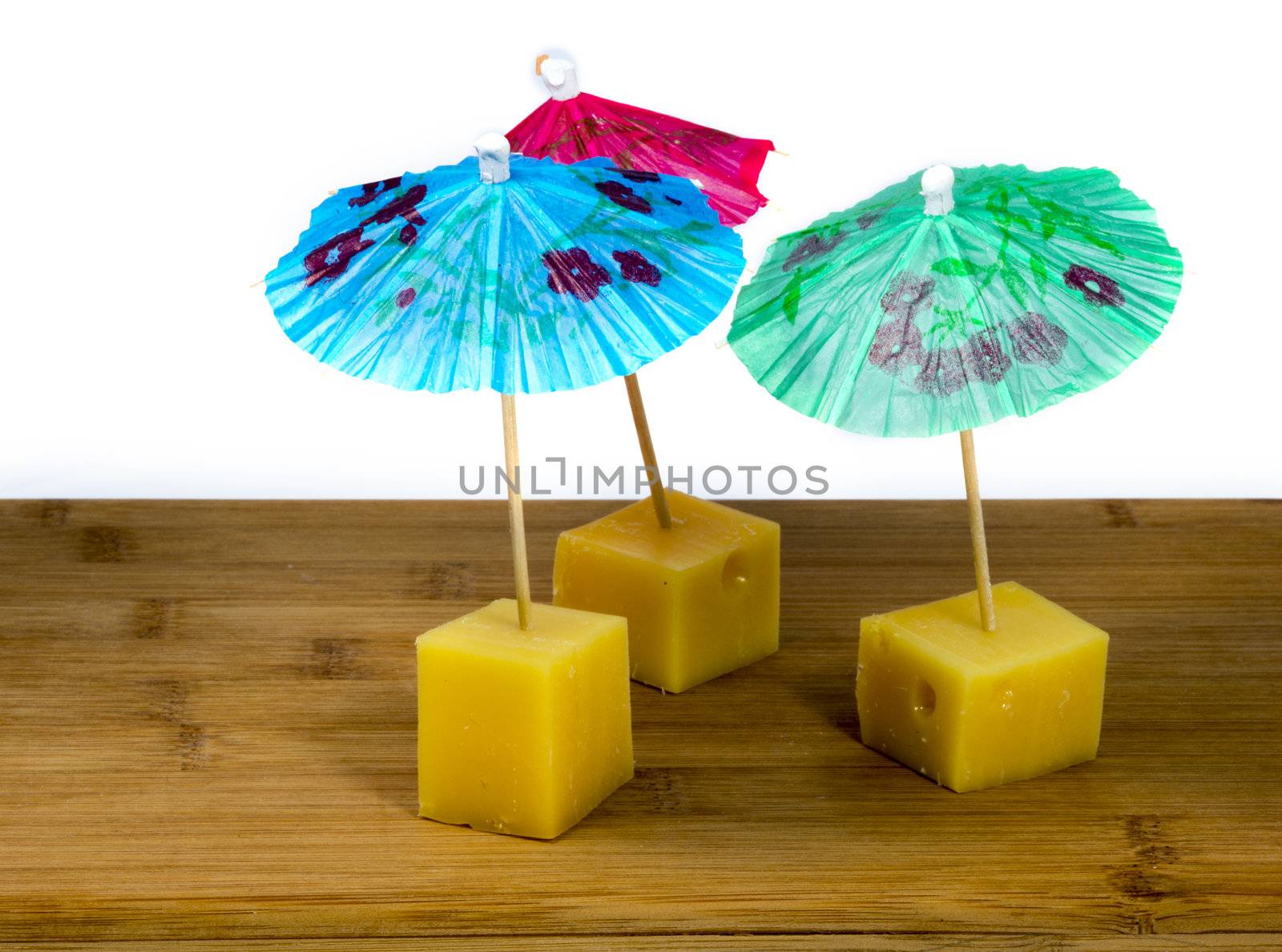 dutch cheese snacks with umbrella in blue red and green