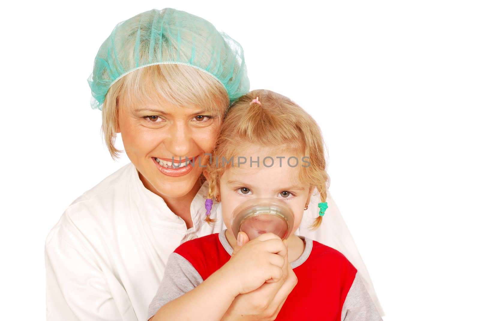 Female doctor gives the child inhalation studio shot