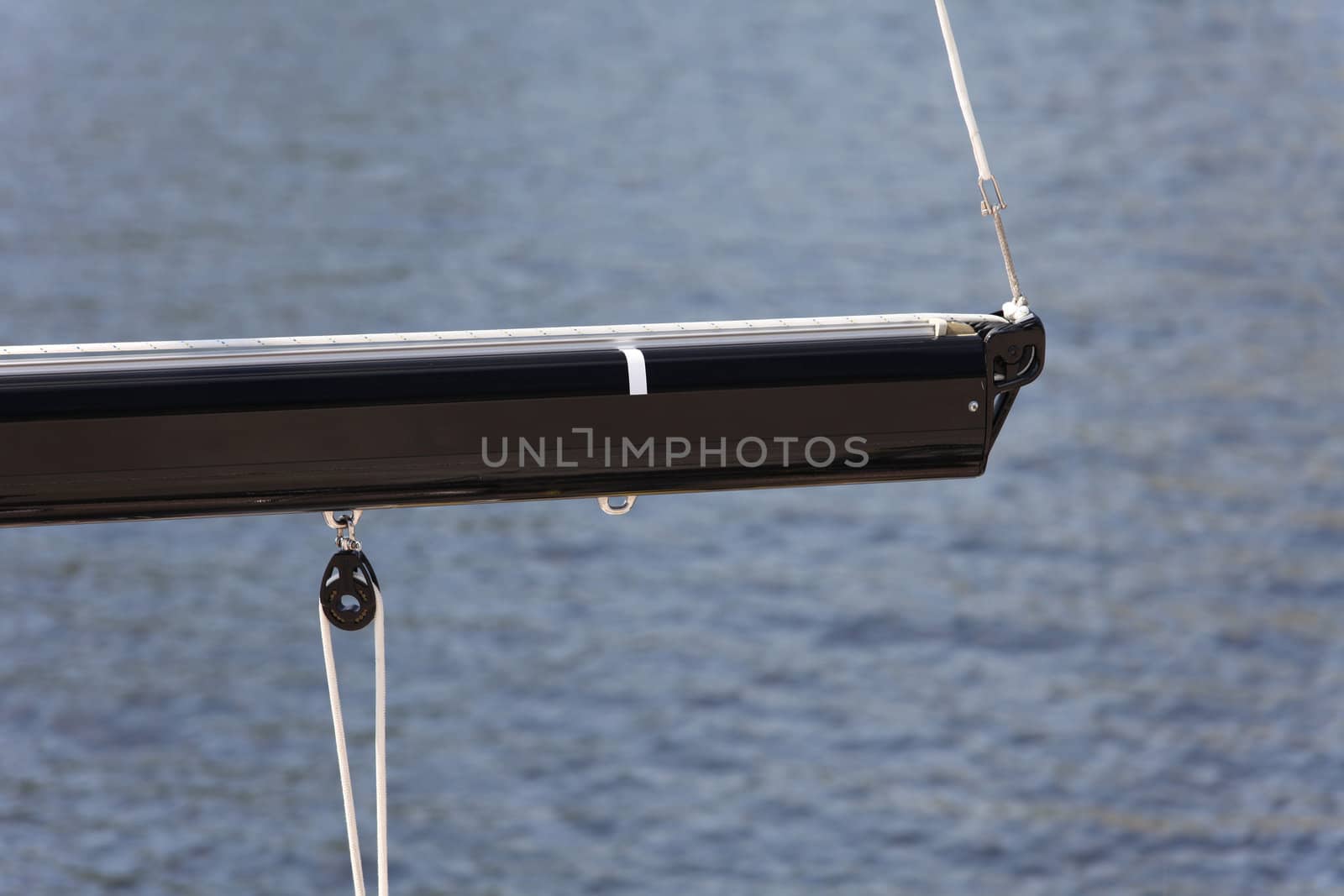 modern boom rope pulley, isolated against sea