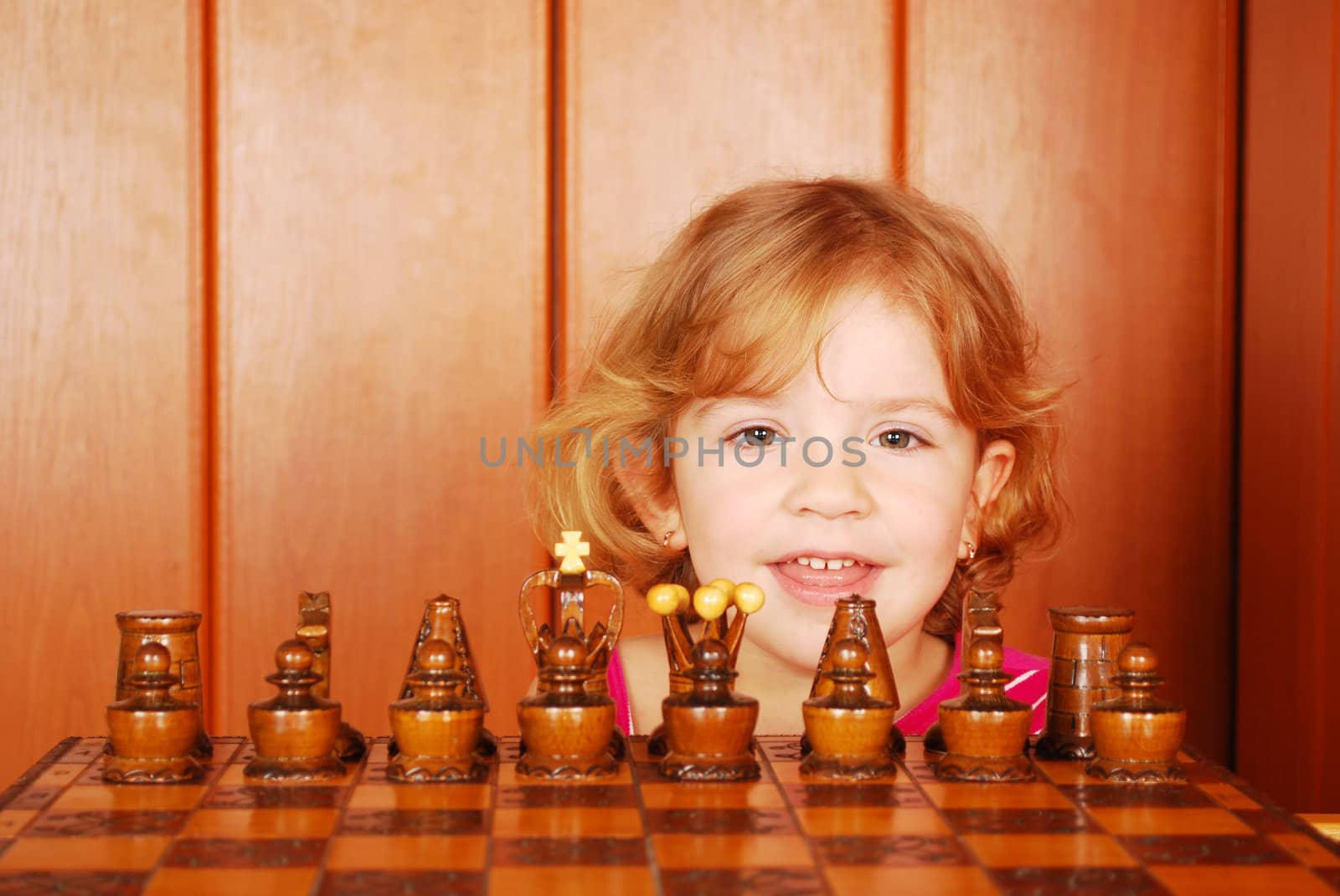Beauty little girl and chess