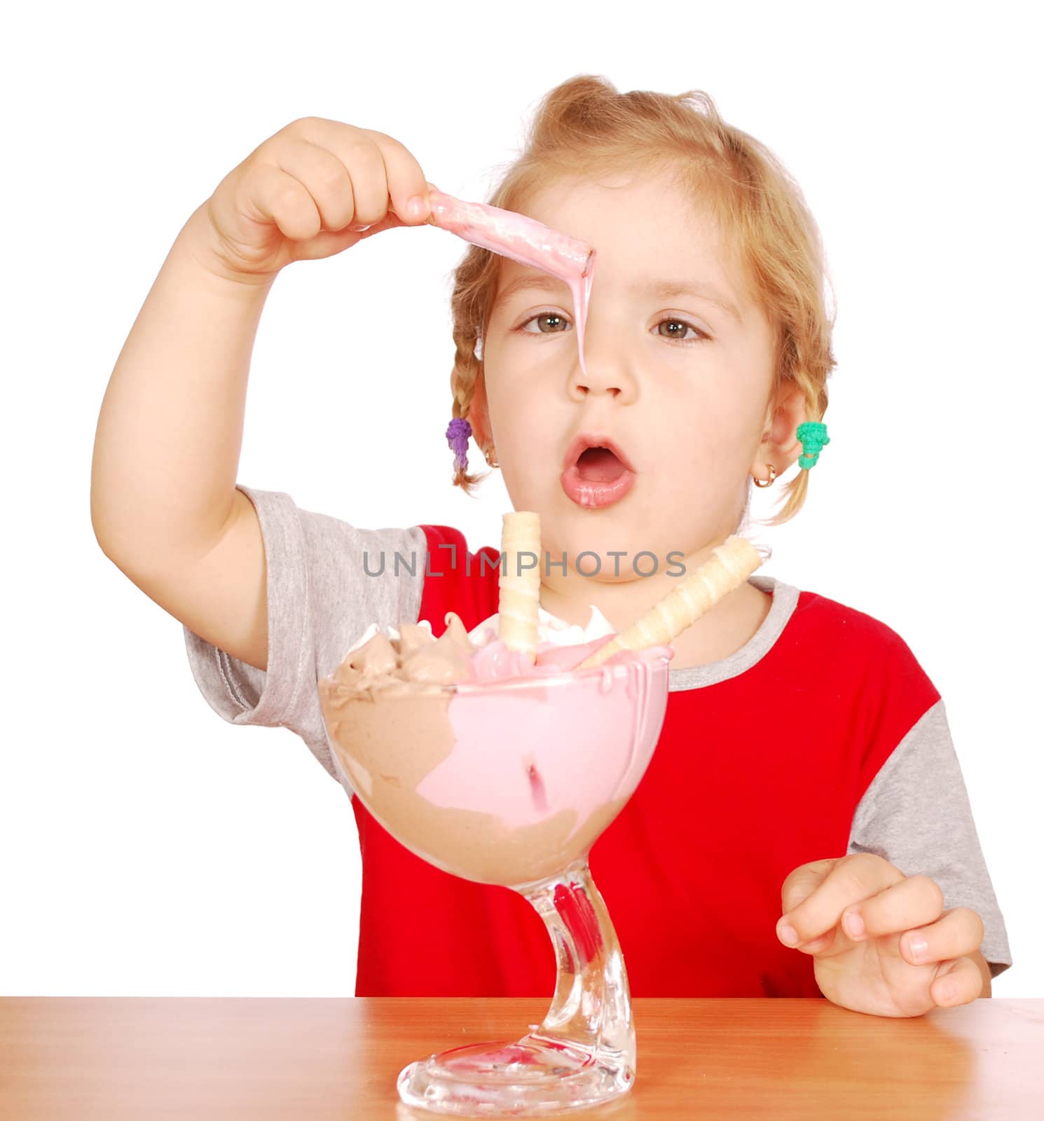 Little girl enjoy in ice cream studio shot