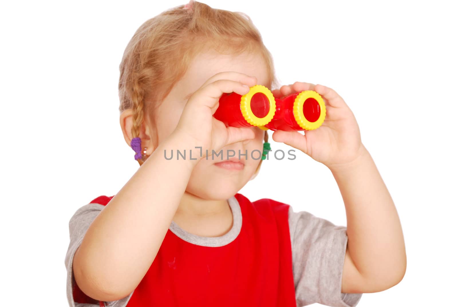 Little girl with binoculars studio shot