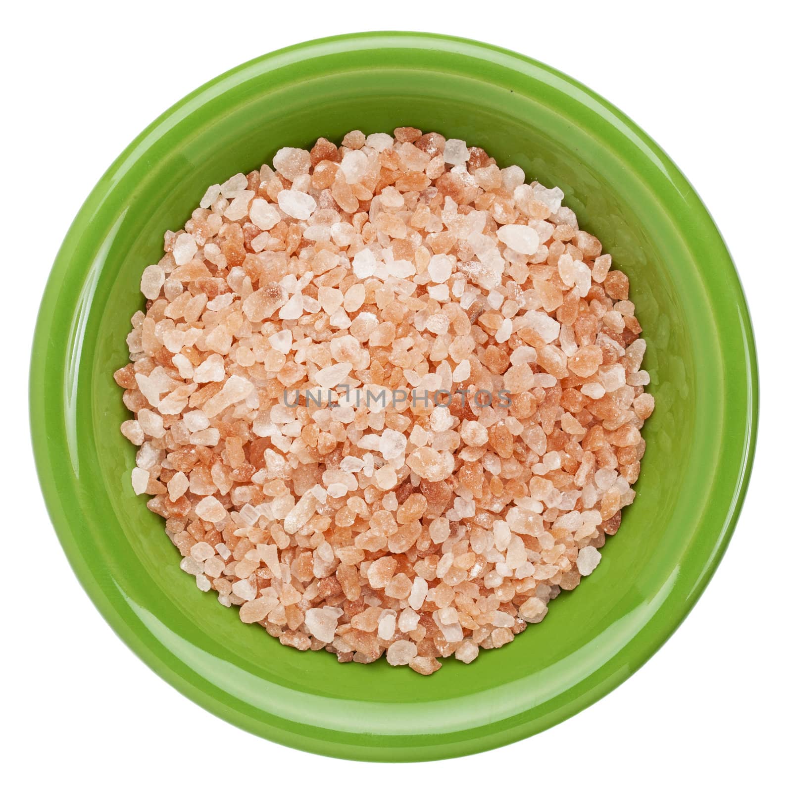 Himalayan salt coarse crystals in green ceramic bowl isolated on white