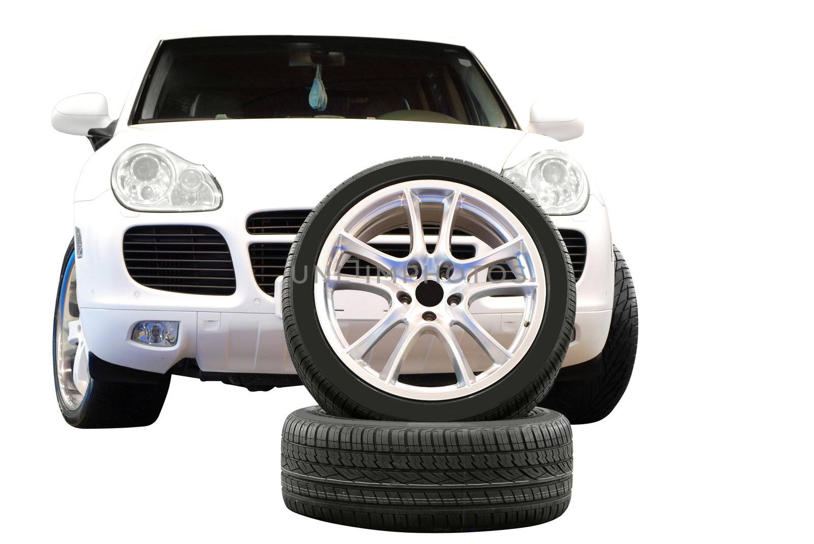 Car aluminum wheel and 4x4 suv isolated on white