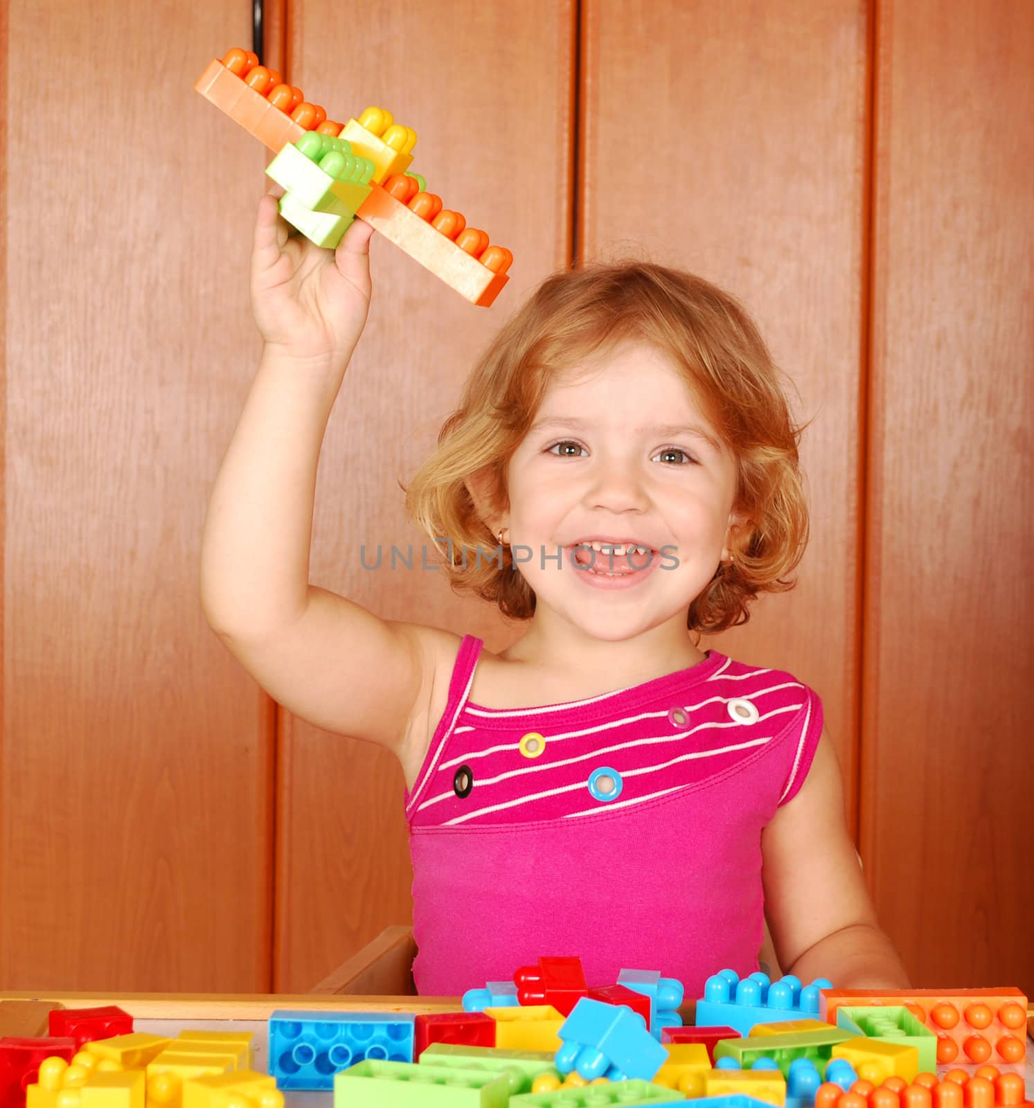 Beauty little girl fun with toy block