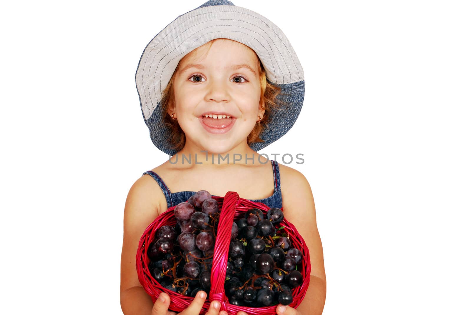 Beauty little girl with grapes